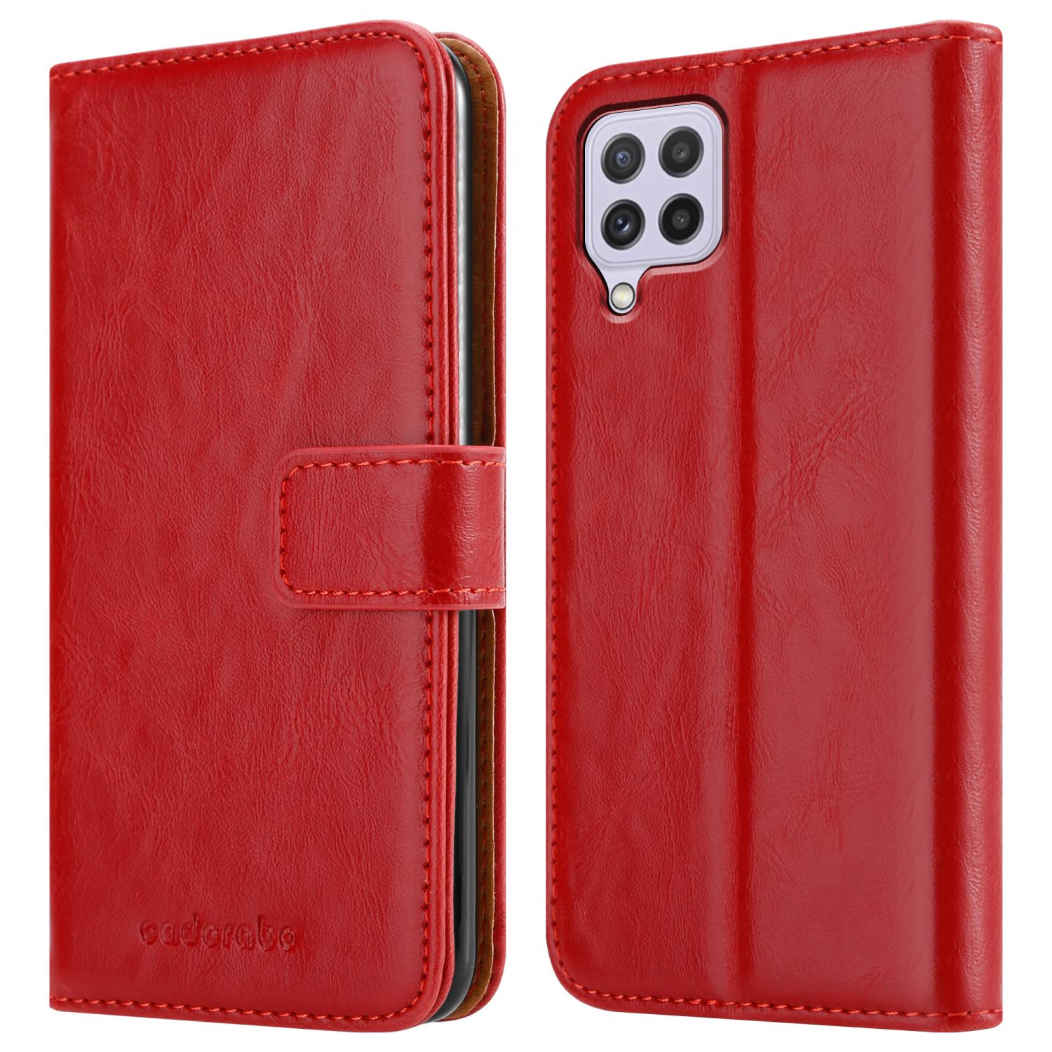 Custodia rossa aperta, telefono all'interno. Testo: fessure per carte e altri dettagli. Il telefono è all'interno.