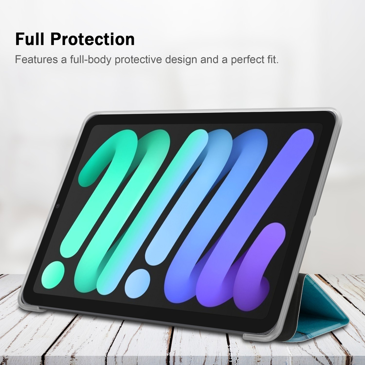 Tablet in una custodia su un tavolo di legno. Schermo blu, viola e verde.