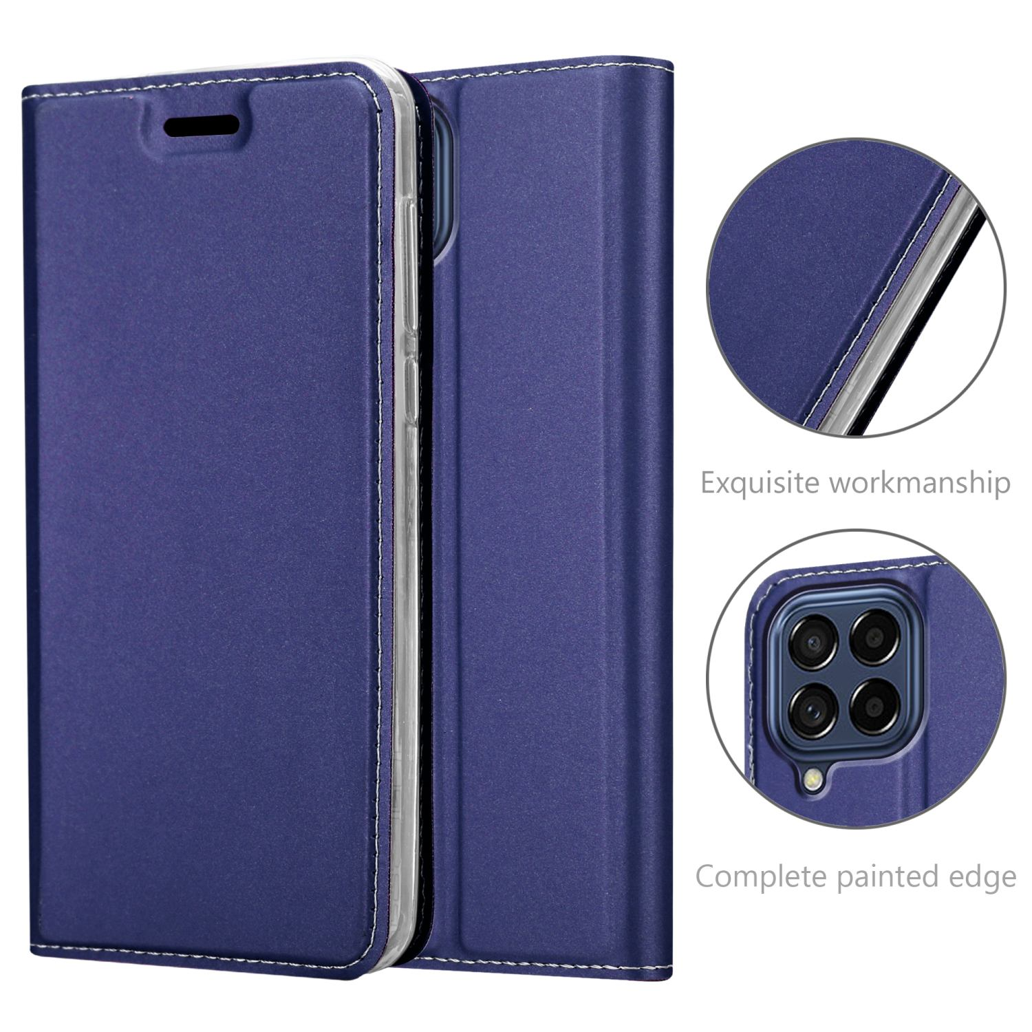 Custodia per telefono blu navy aperta. Dettagli mostrano cuciture e area della fotocamera.