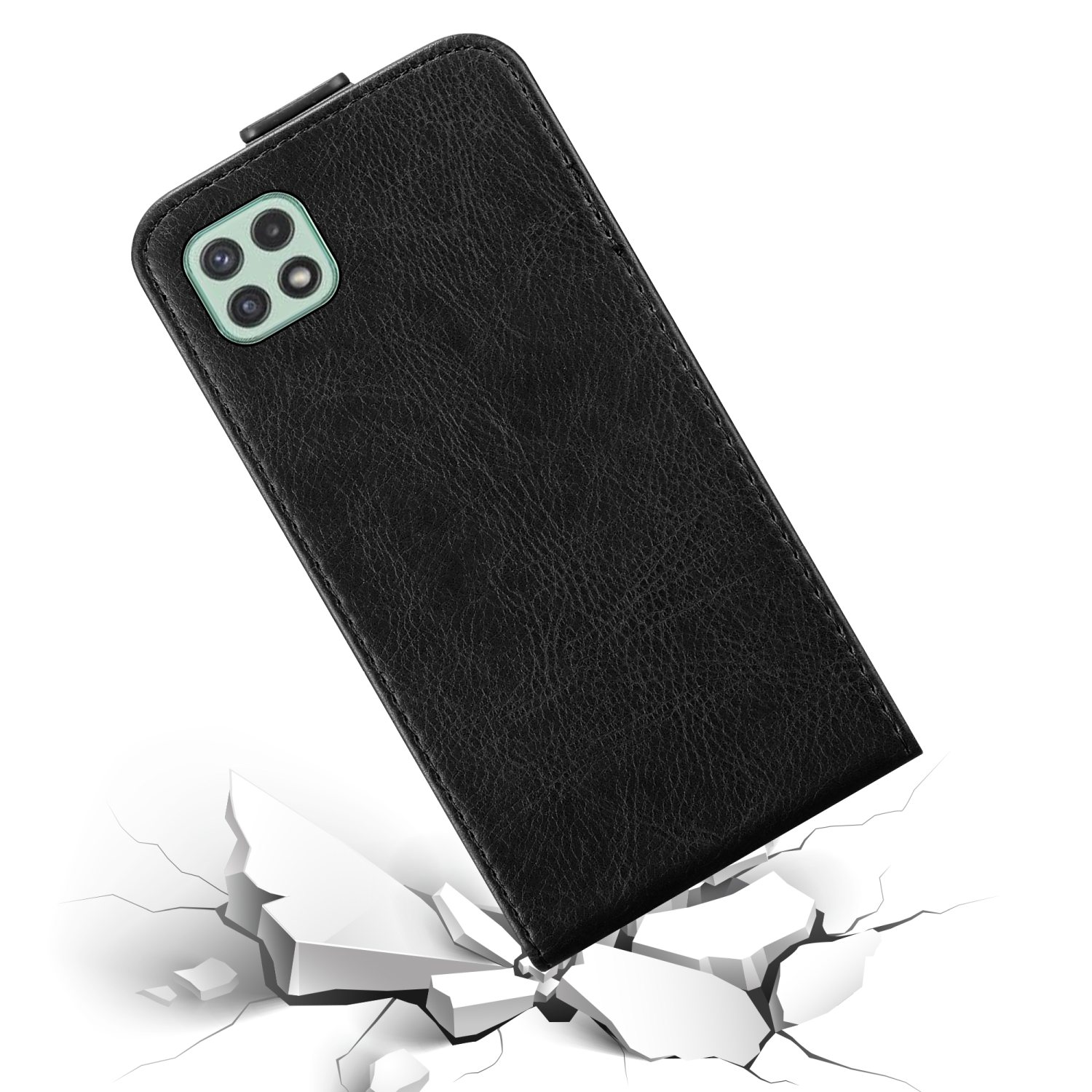 Custodia nera con texture in pelle, che cade su una superficie rotta.