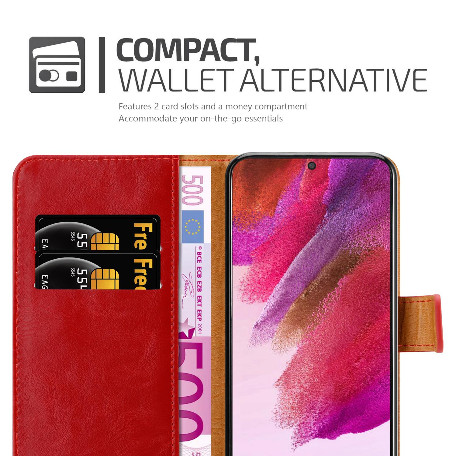 Custodia rossa per telefono con carte e banconota da 500 euro accanto a uno smartphone con schermo rosa.