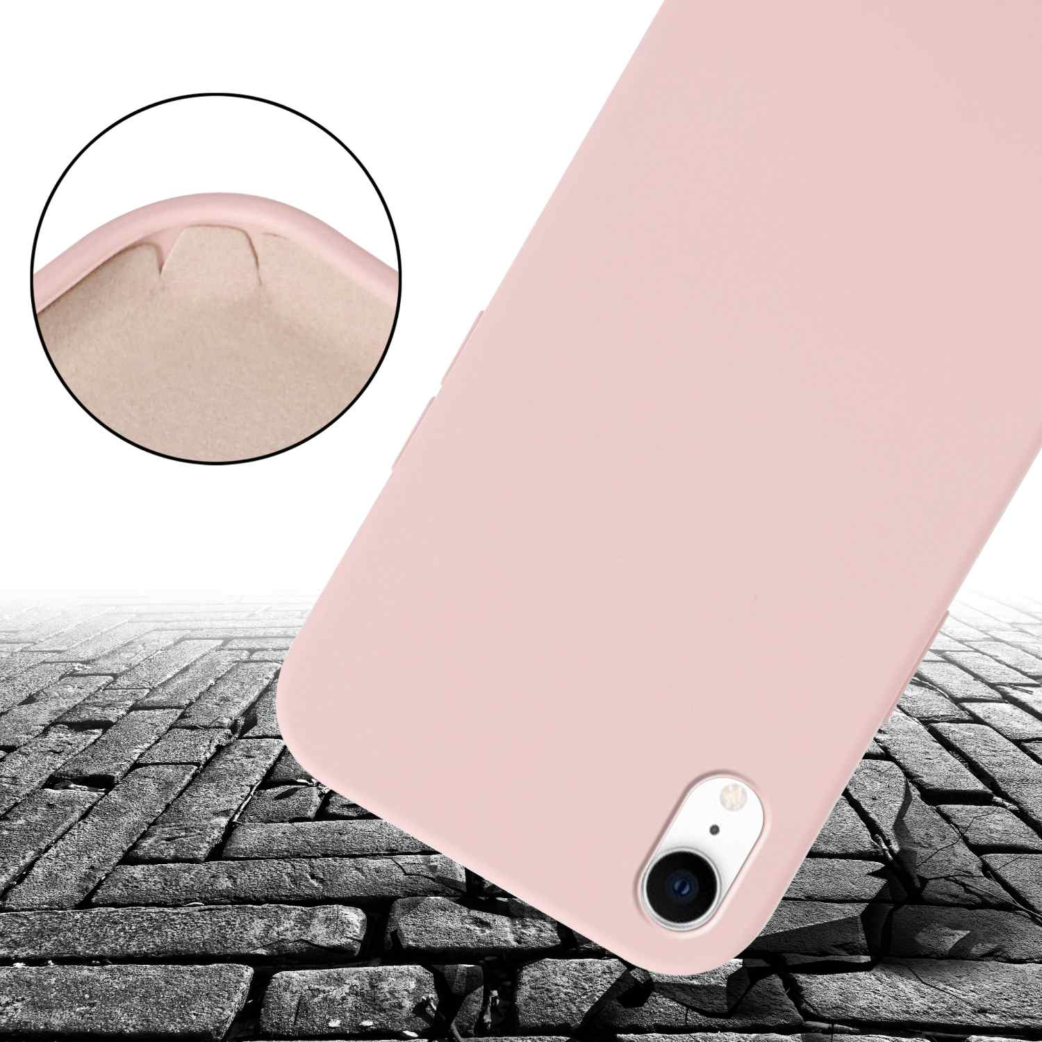 Custodia per telefono rosa su una superficie di mattoni. Dettagli angolari visibili.