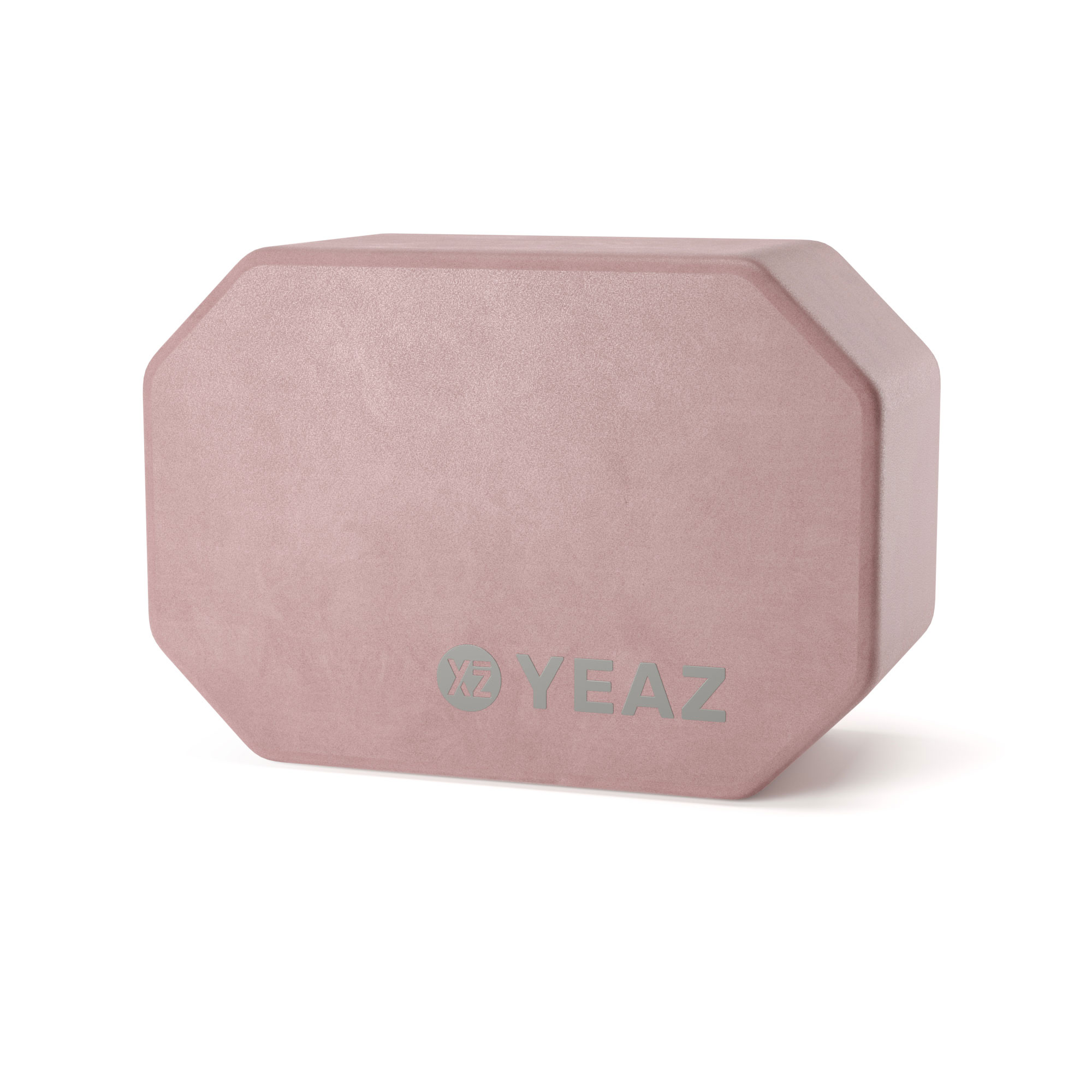 Rosa sechseckiger Yoga-Block mit YEAZ-Logo darauf, auf weißem Hintergrund.