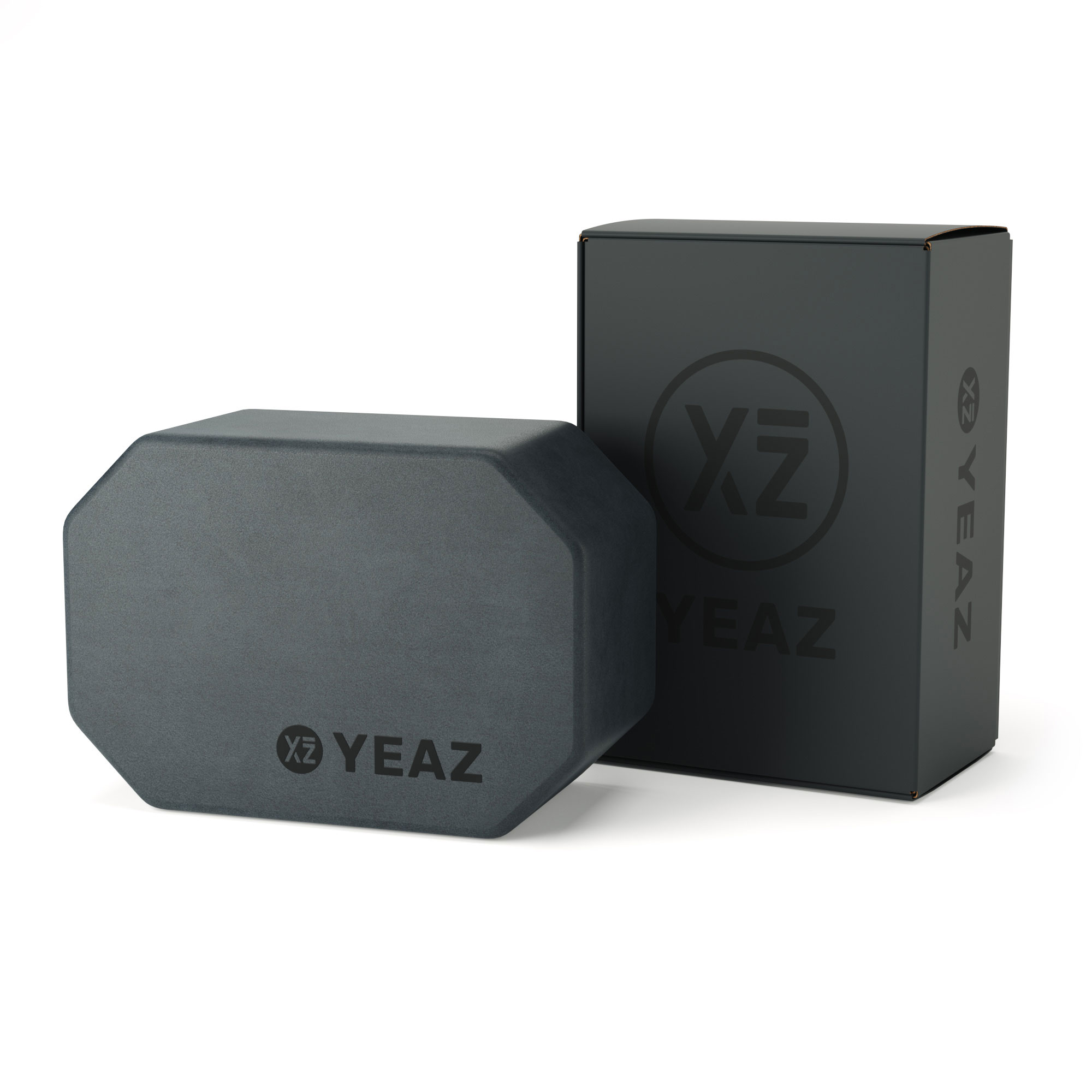 Ein grauer achteckiger Yogablock und eine schwarze Box mit dem 'YEAZ'-Logo.