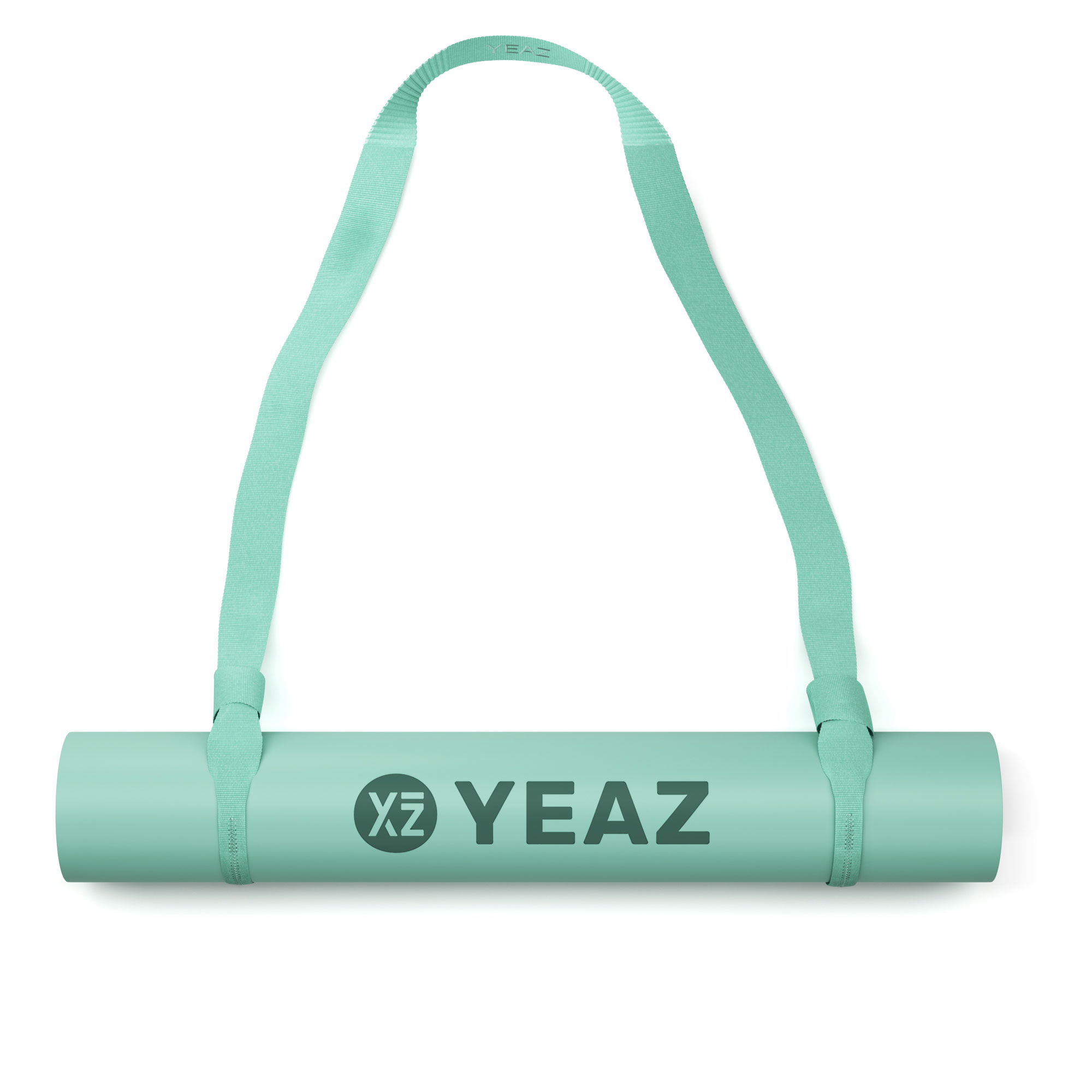 Gerollte Yogamatte mit Trägern. Grüne Matte mit schwarzem 'YEAZ'-Logo. Grüne Träger an beiden Enden.