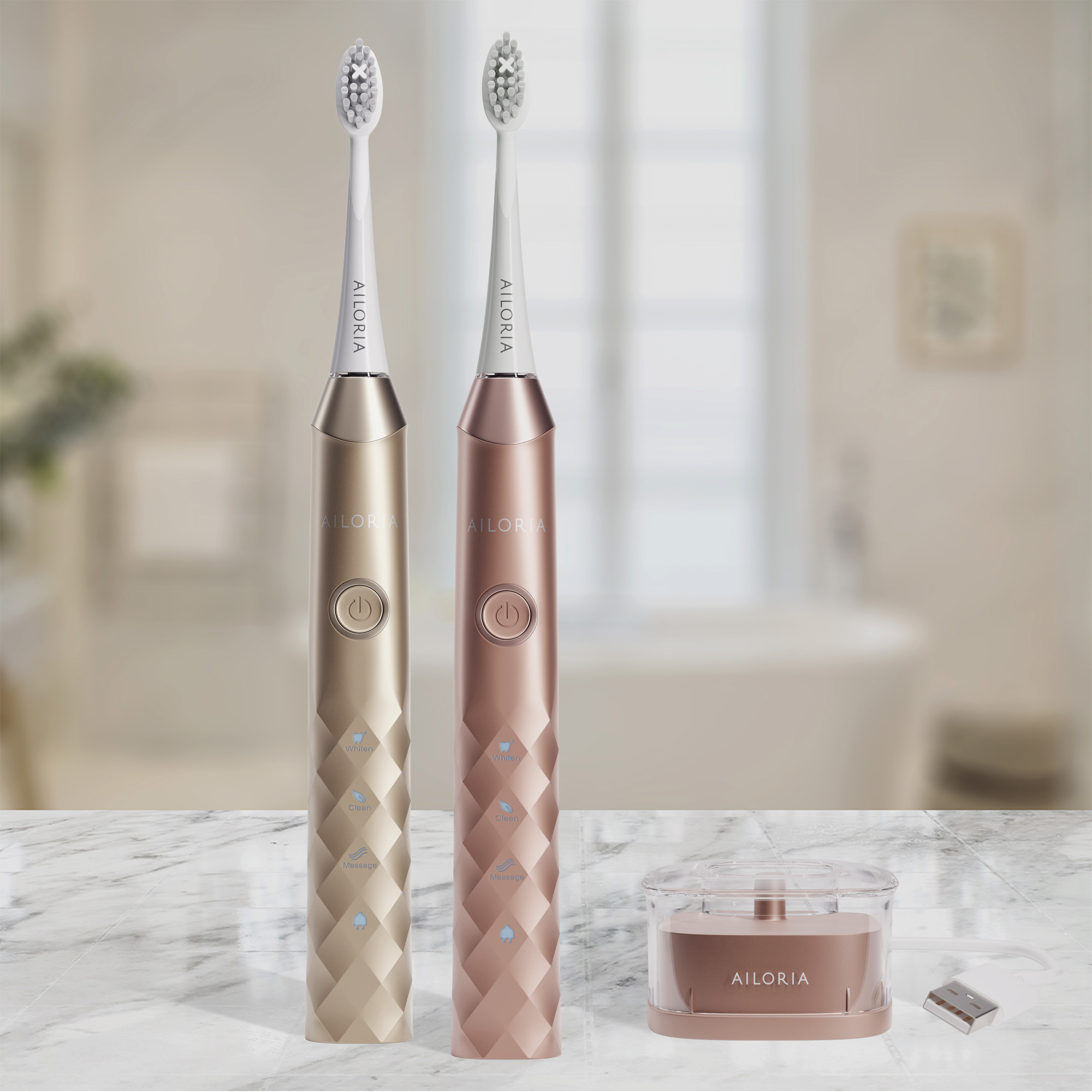 Zwei elektrische Zahnbürsten. Gold- und Roségoldfarbe. Zahnbürste und Ladestation. Weißes Badezimmer.