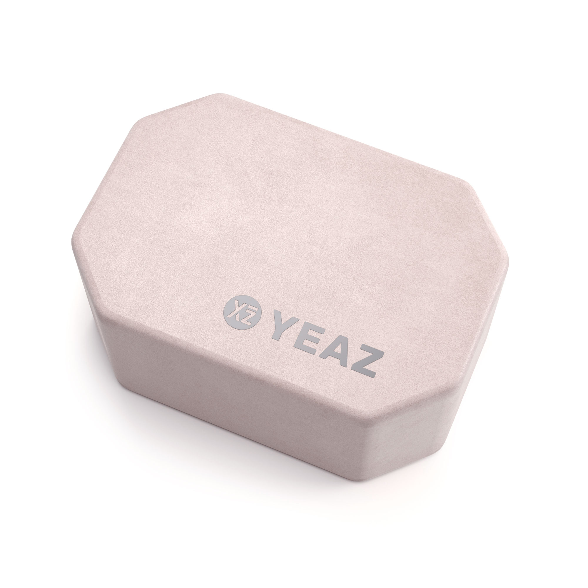 Ein hellrosa, geometrisch geformter Yogablock mit dem Aufdruck "YEAZ".