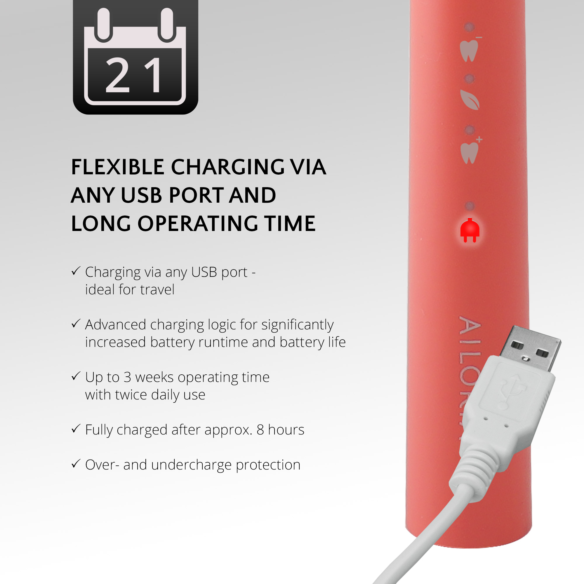 Cepillo de dientes eléctrico rosa coral con cable USB blanco. Luz de carga roja encendida.