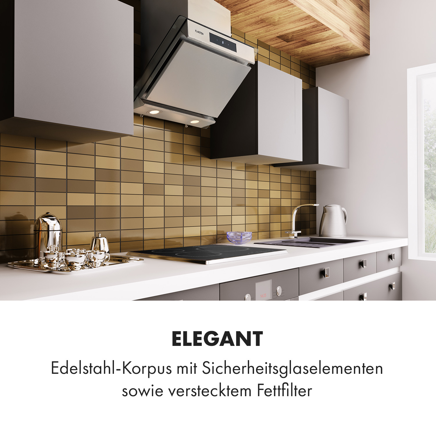 Cocina con campana extractora de acero inoxidable sobre una placa de inducción, armarios y encimera.