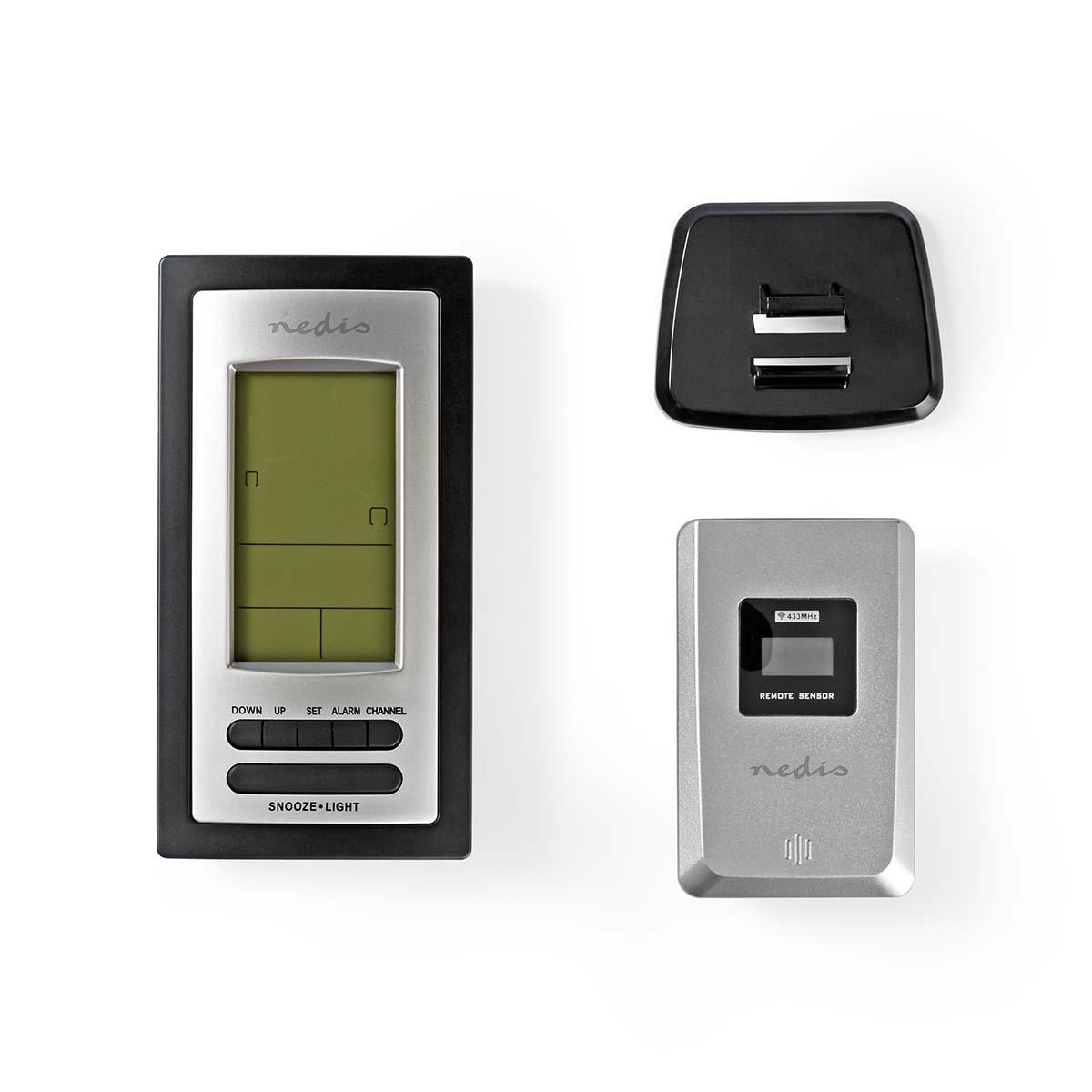 Stacja pogodowa z wyświetlaczem, portem USB i czujnikiem, wszystko na białym tle.