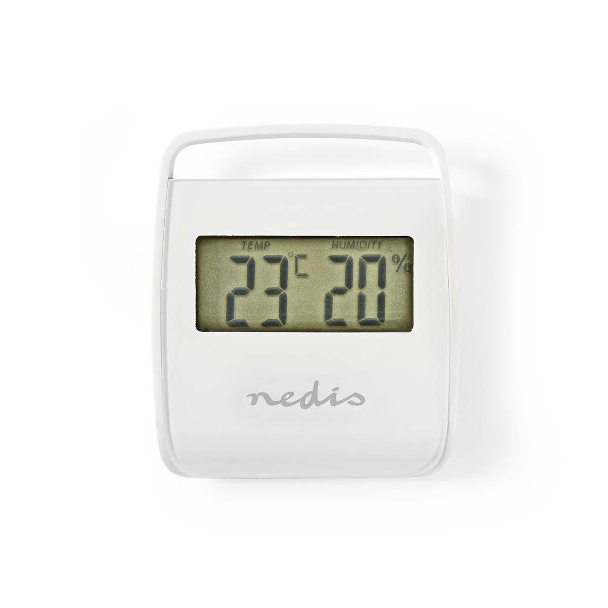 Ein weißes digitales Thermometer zeigt 23 Grad und 20 % Luftfeuchtigkeit an, vor Weiß.
