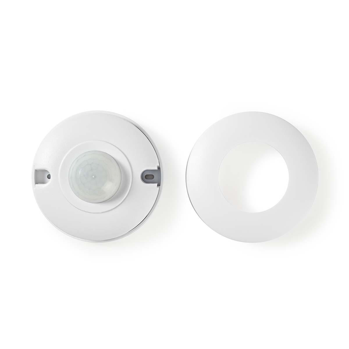 Dos componentes de sensor de movimiento blancos, uno con lente y otro con anillo de montaje.
