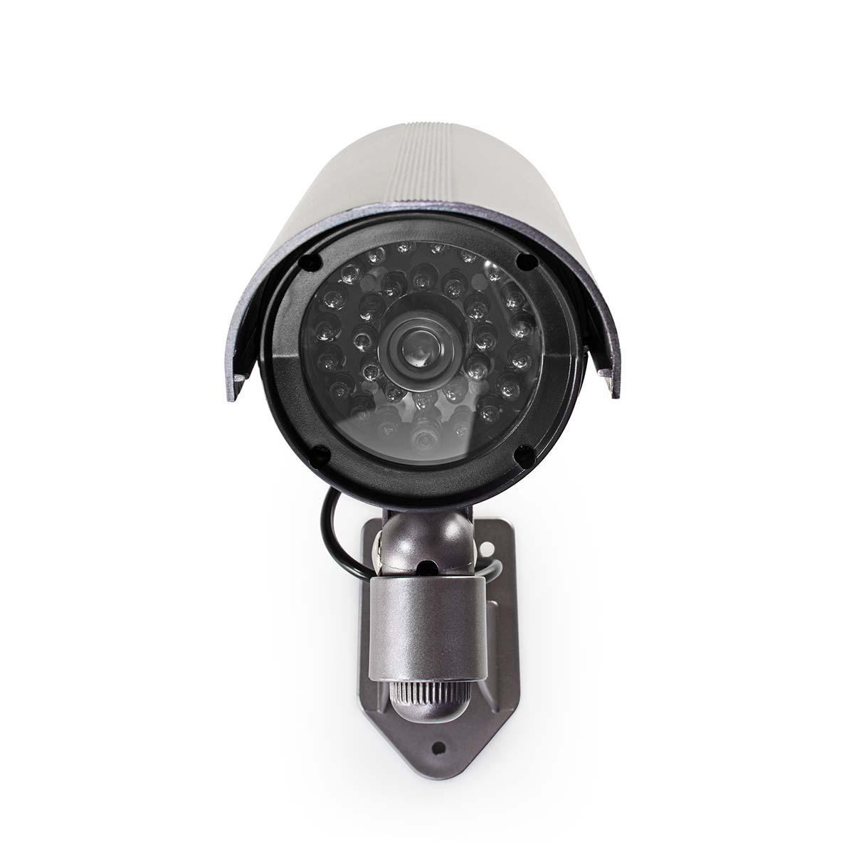 Telecamera di sicurezza nera con cappuccio protettivo. Ha obiettivo e LED.