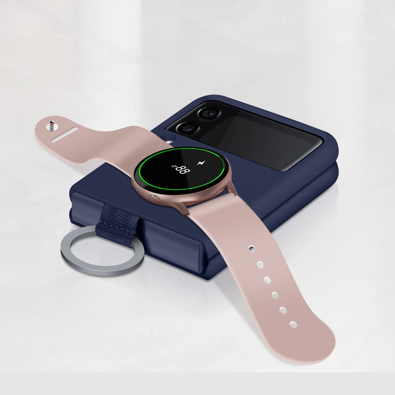 Eine Smartwatch und ein Telefon auf weißer Oberfläche. Die Uhr ist rosa, das Telefon blau.