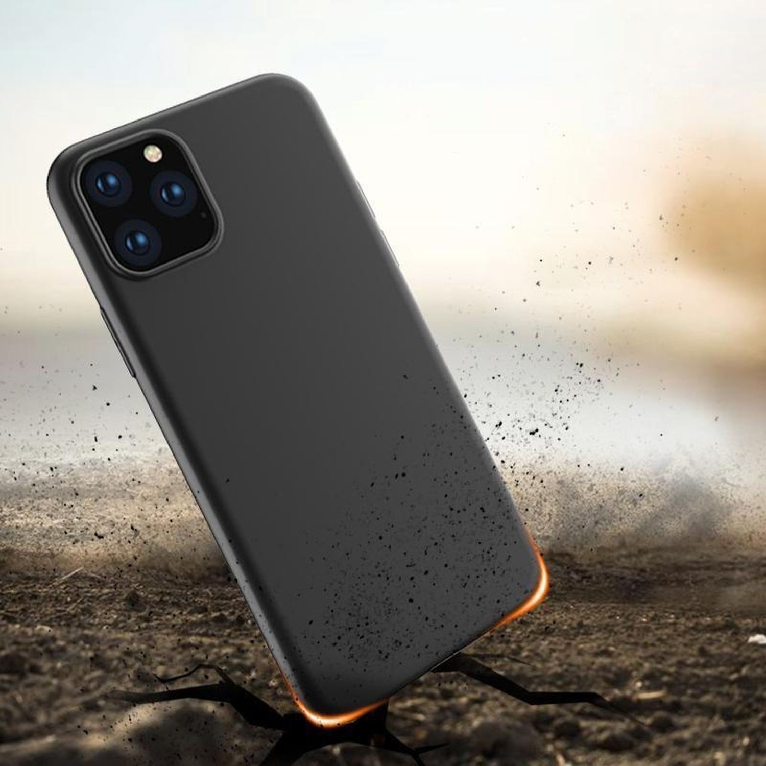 Schwarze Handyhülle, das Telefon liegt auf dem Boden, Staubeffekt, verschwommener Hintergrund.