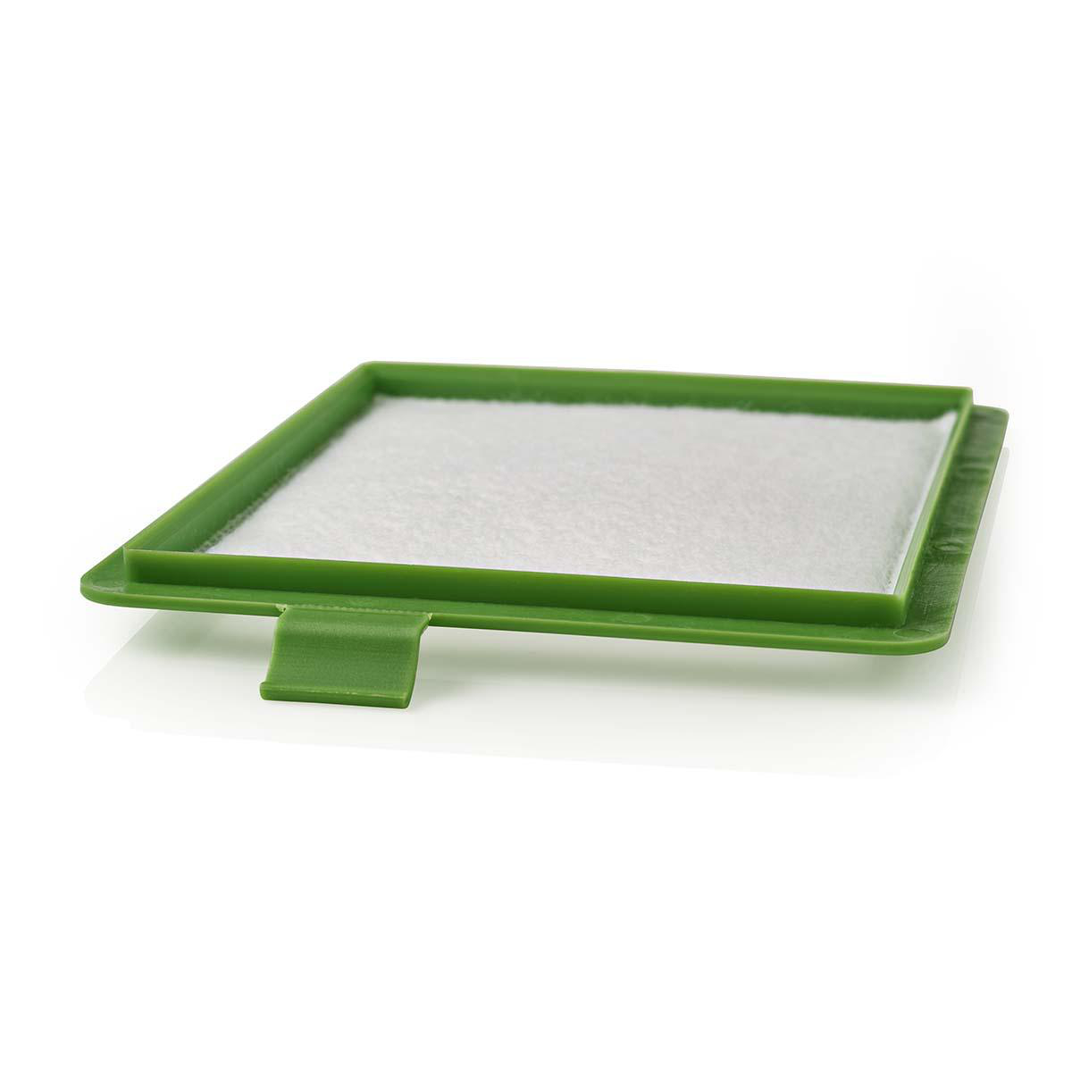 Cornice per filtro per aspirapolvere in plastica verde con un filtro bianco all'interno. Sfondo bianco.