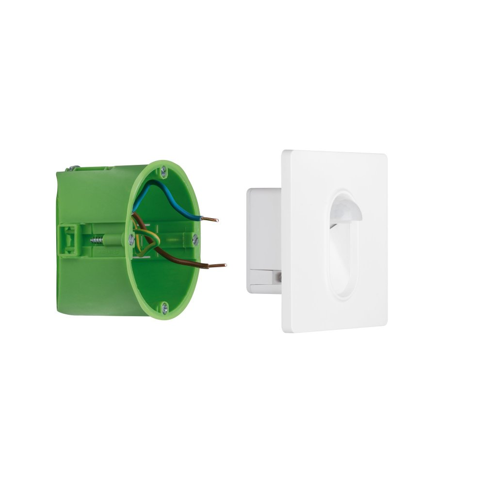 Eine grüne Elektrobox mit Drähten neben einer weißen Leuchtenkomponente.