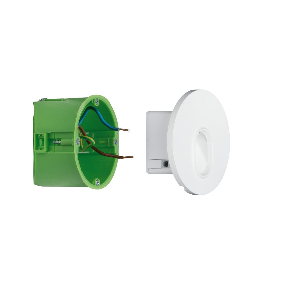 Eine grüne Elektrobox mit Kabeln und eine weiße, kreisförmige Leuchte rechts.