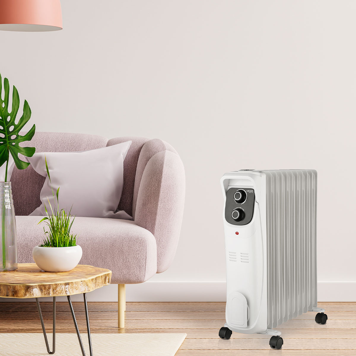 Biały grzejnik olejowy w pokoju. Różowa sofa i drewniany stół.