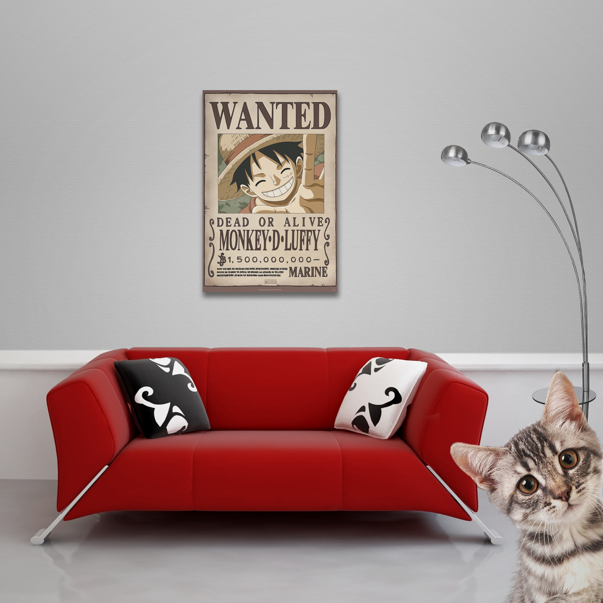 Rotes Sofa mit Kissen, eine Katze und ein Poster. Auf dem Poster steht WANTED Monkey D. Luffy.