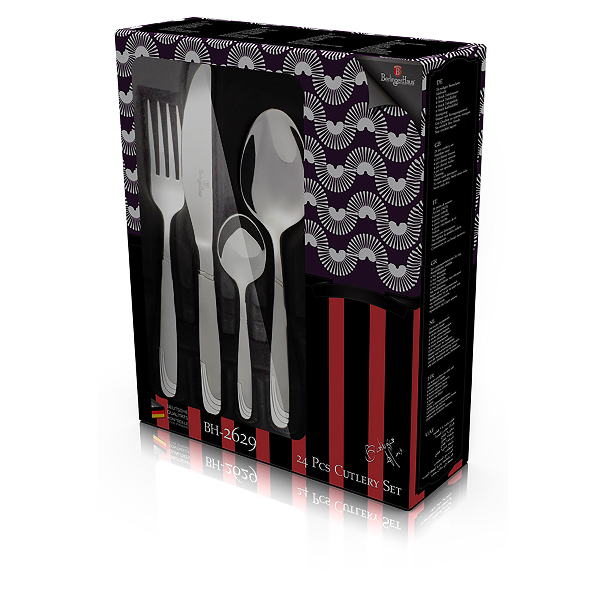 Un juego de cubiertos en una caja. El juego incluye un tenedor, un cuchillo, una cuchara y una cuchara más pequeña.