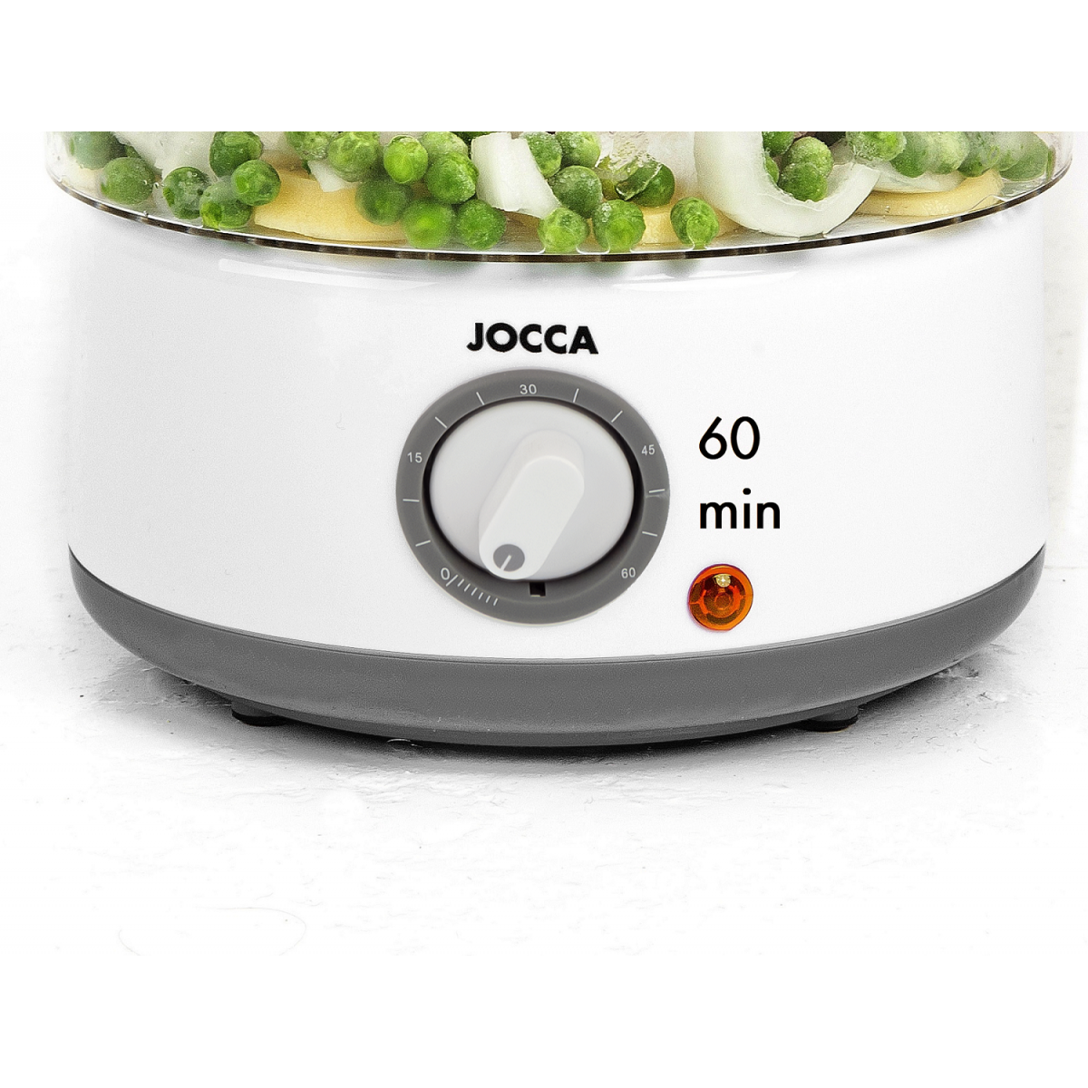 Vaporiera bianca e grigia con verdure all'interno, con timer sul davanti.