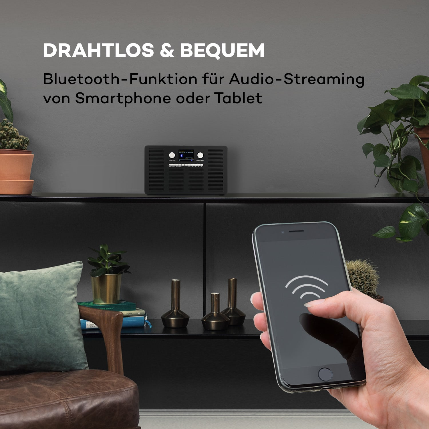 Ein schwarzes Radio mit Smartphone, das ein WLAN-Signal anzeigt. Oben steht: DRAHTLOS & BEQUEM.