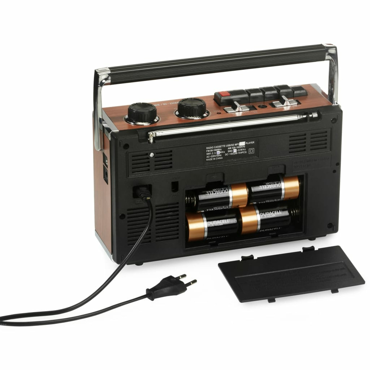Retro-Radio mit Holzoberfläche. Rückseite zeigt Batteriefach und Netzkabel.