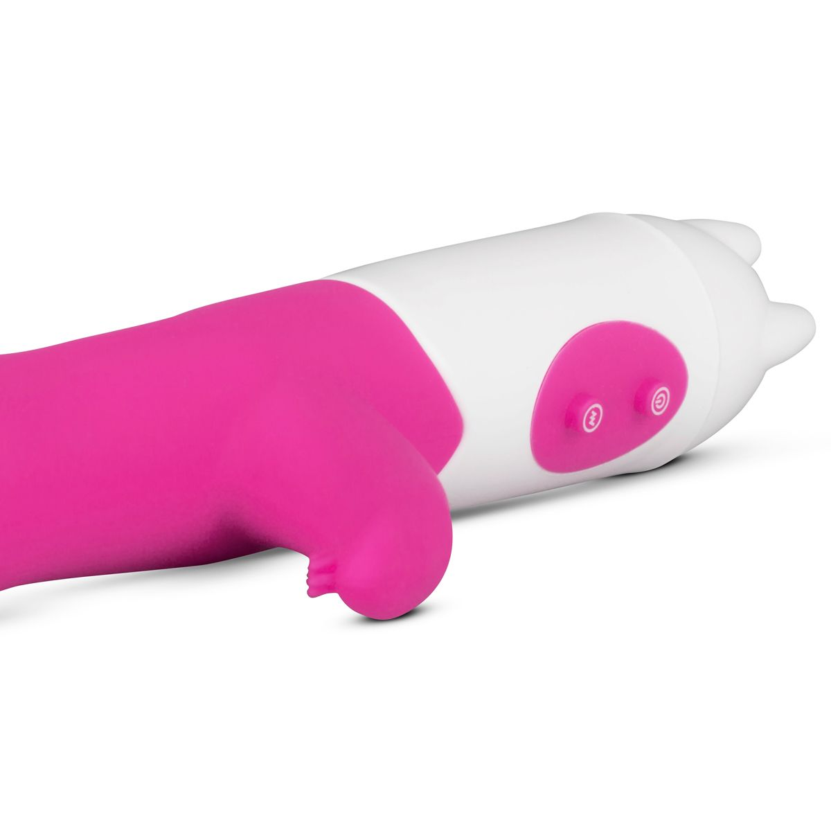 Ein weißes und rosa Sexspielzeug mit Knöpfen und gebogener Form liegt auf einer weißen Oberfläche.