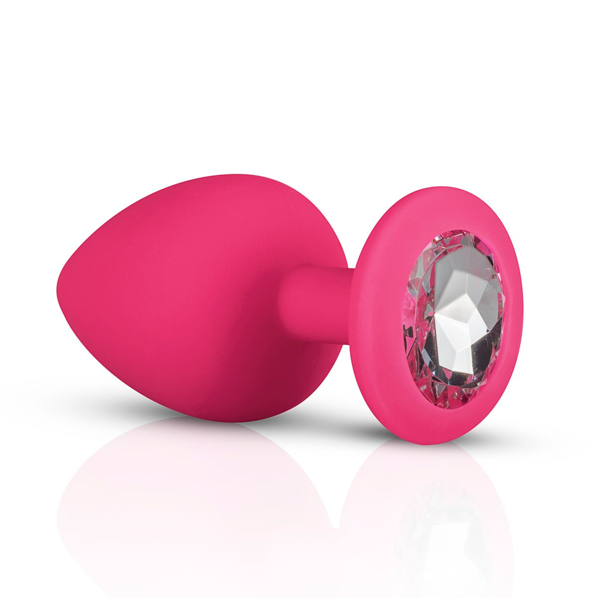 Ein pinkfarbenes Sexspielzeug mit einem Juwel an der Basis, auf einer weißen Oberfläche. Das Spielzeug hat ein spitz zulaufendes Ende und eine abgerundete Basis.