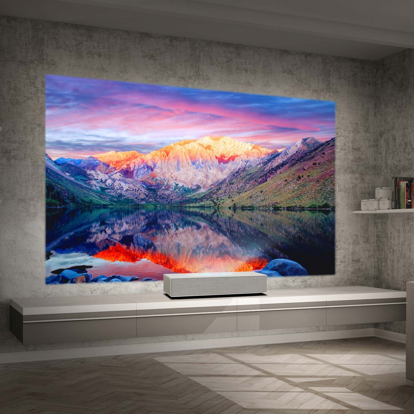 Una pantalla grande muestra una vista escénica del lago con montañas y una barra de sonido debajo.