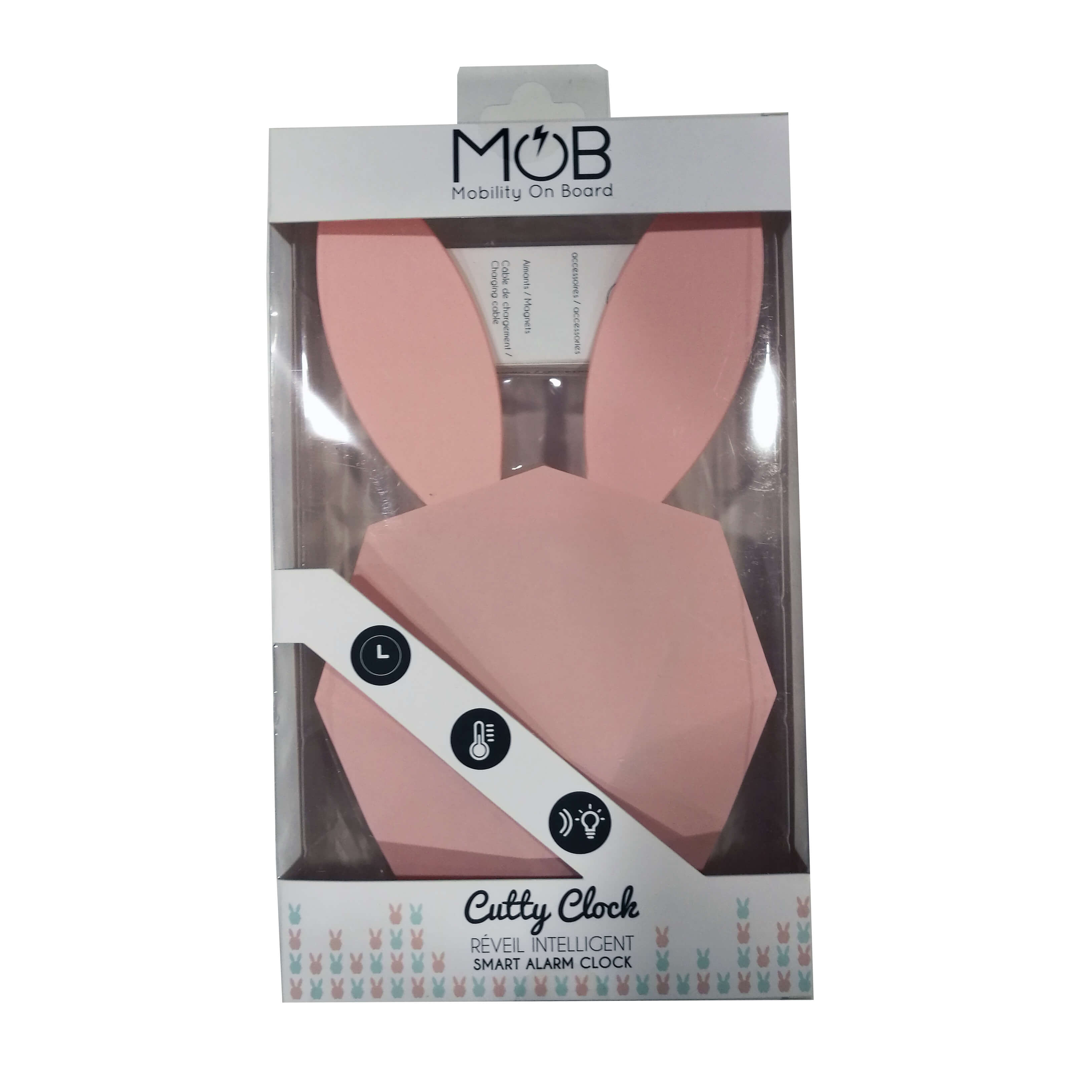 Ein rosa, hasenförmiger Wecker in einer transparenten Box. Er hat ein Band und Symbole.