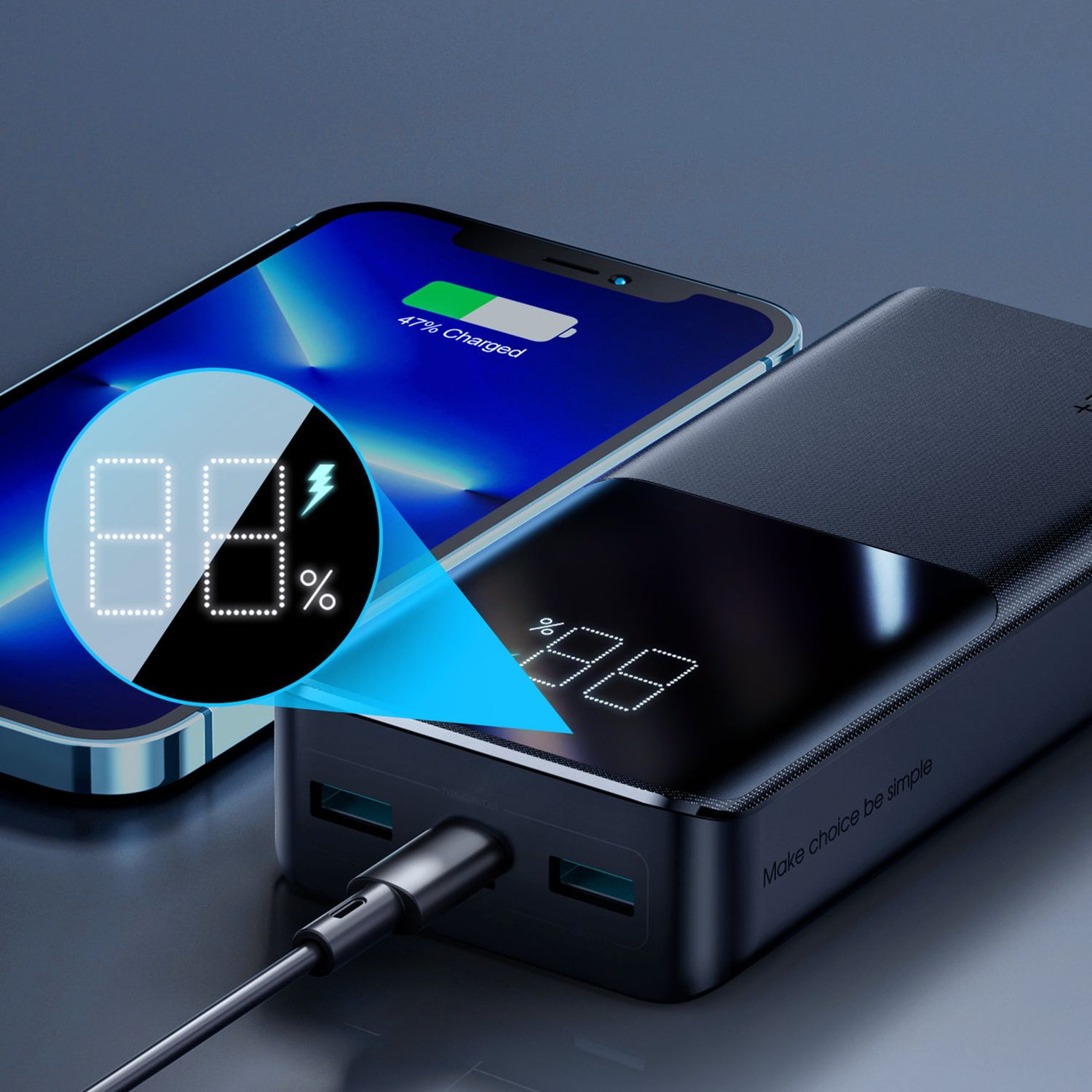 Power bank ładujący telefon, pokazujący procent na obu urządzeniach, czarny kolor.