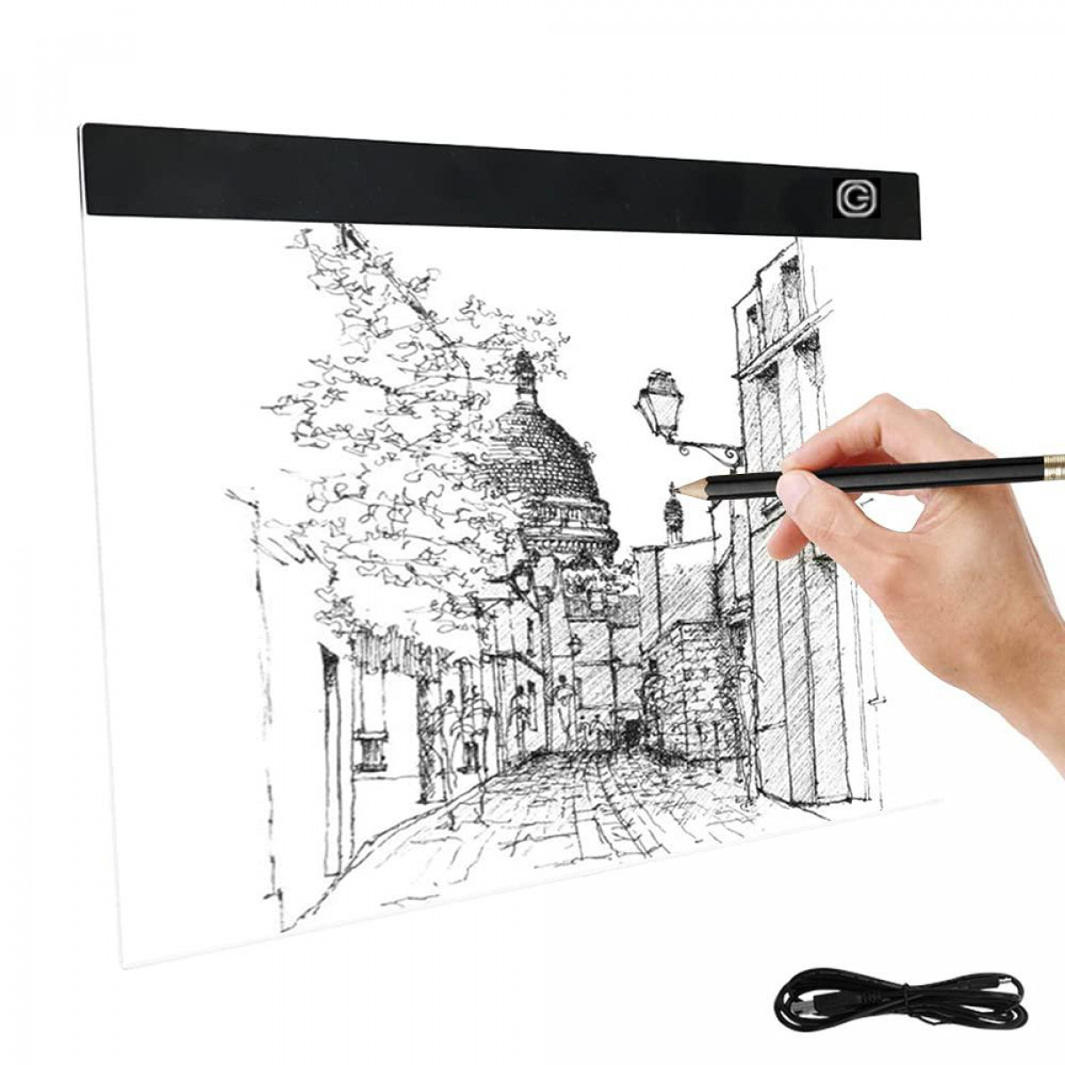 Una mano dibujando una escena de iglesia en una mesa de dibujo iluminada, con un lápiz.