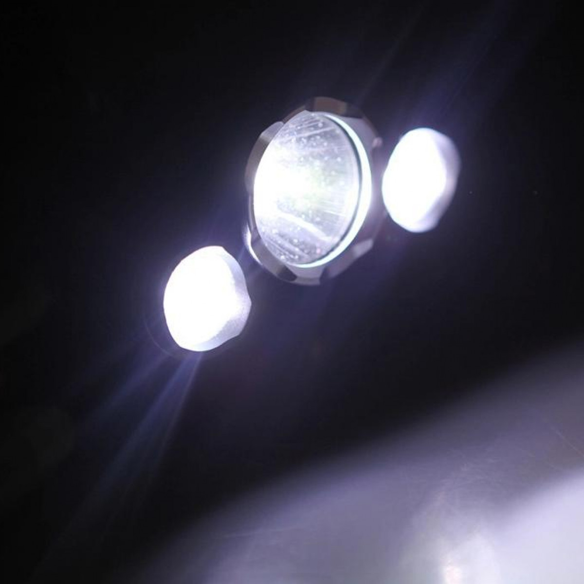 Bright lights shining on a dark background.