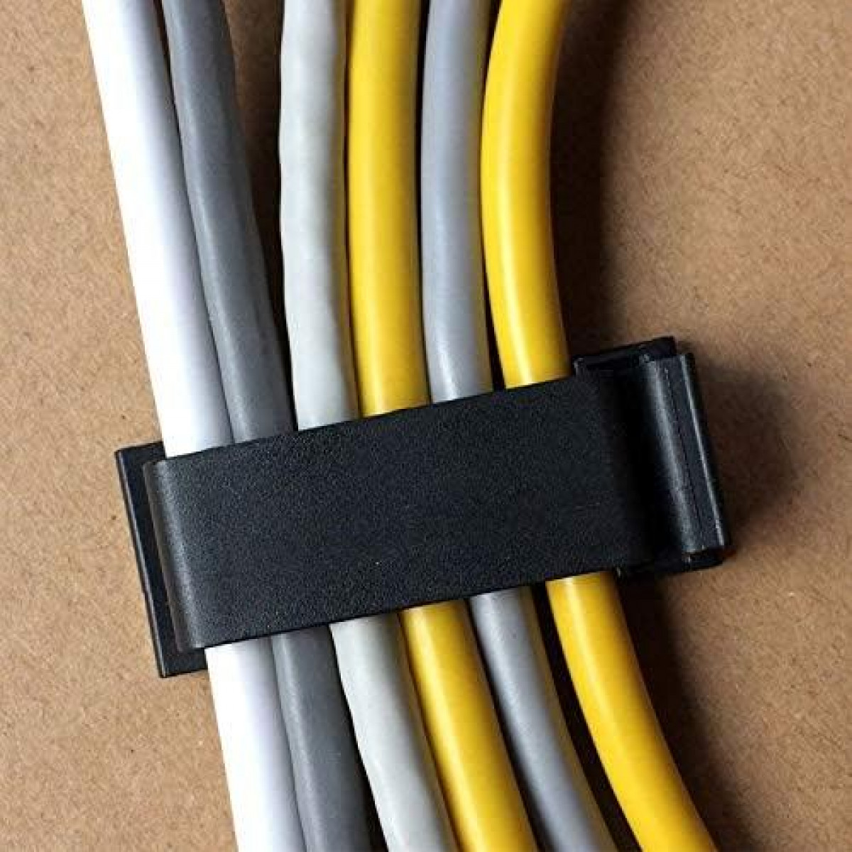 Cables held together by a black clip. Yellow and gray cables are visible.