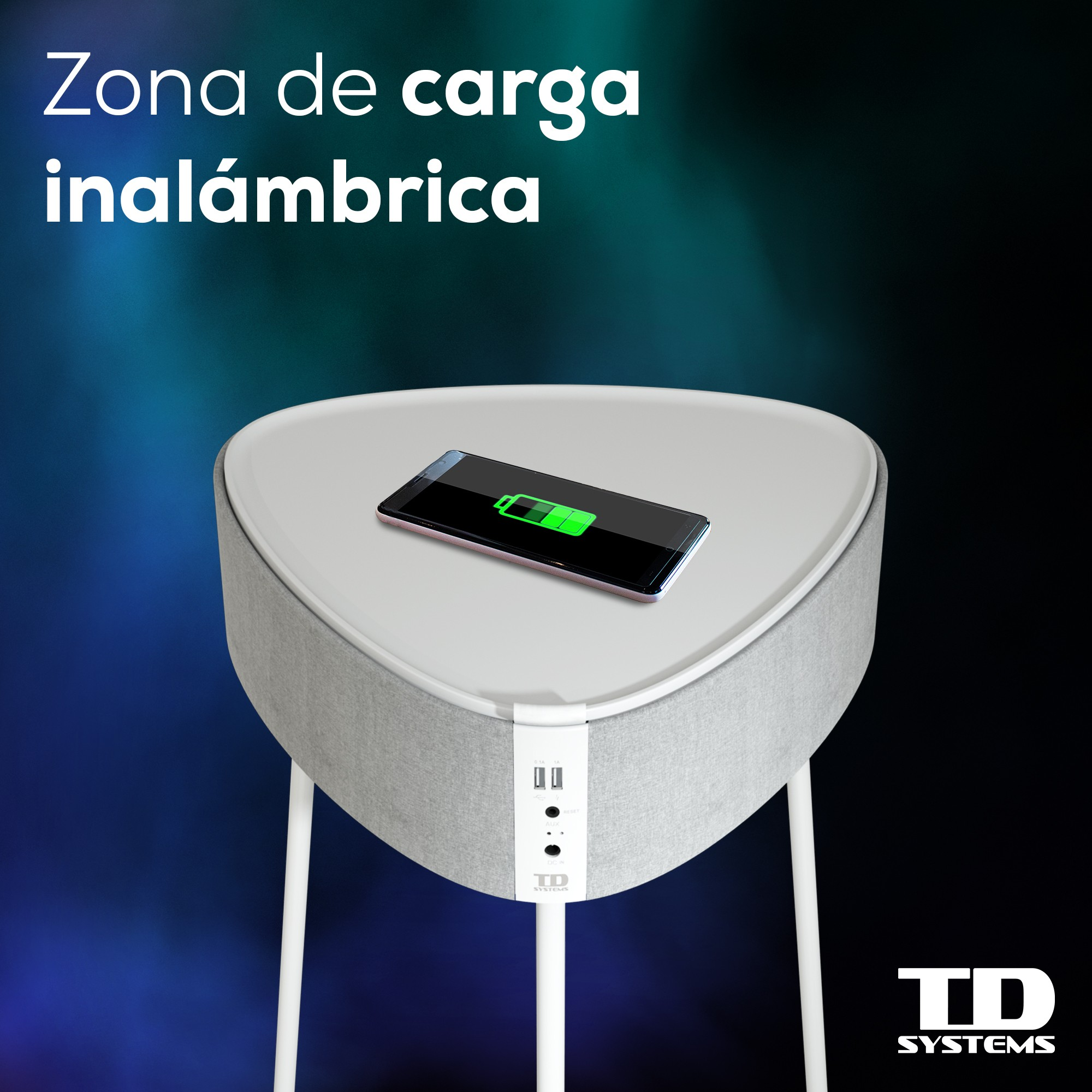 Un altavoz blanco y gris con un teléfono cargándose sobre él. El teléfono tiene un indicador de carga verde.