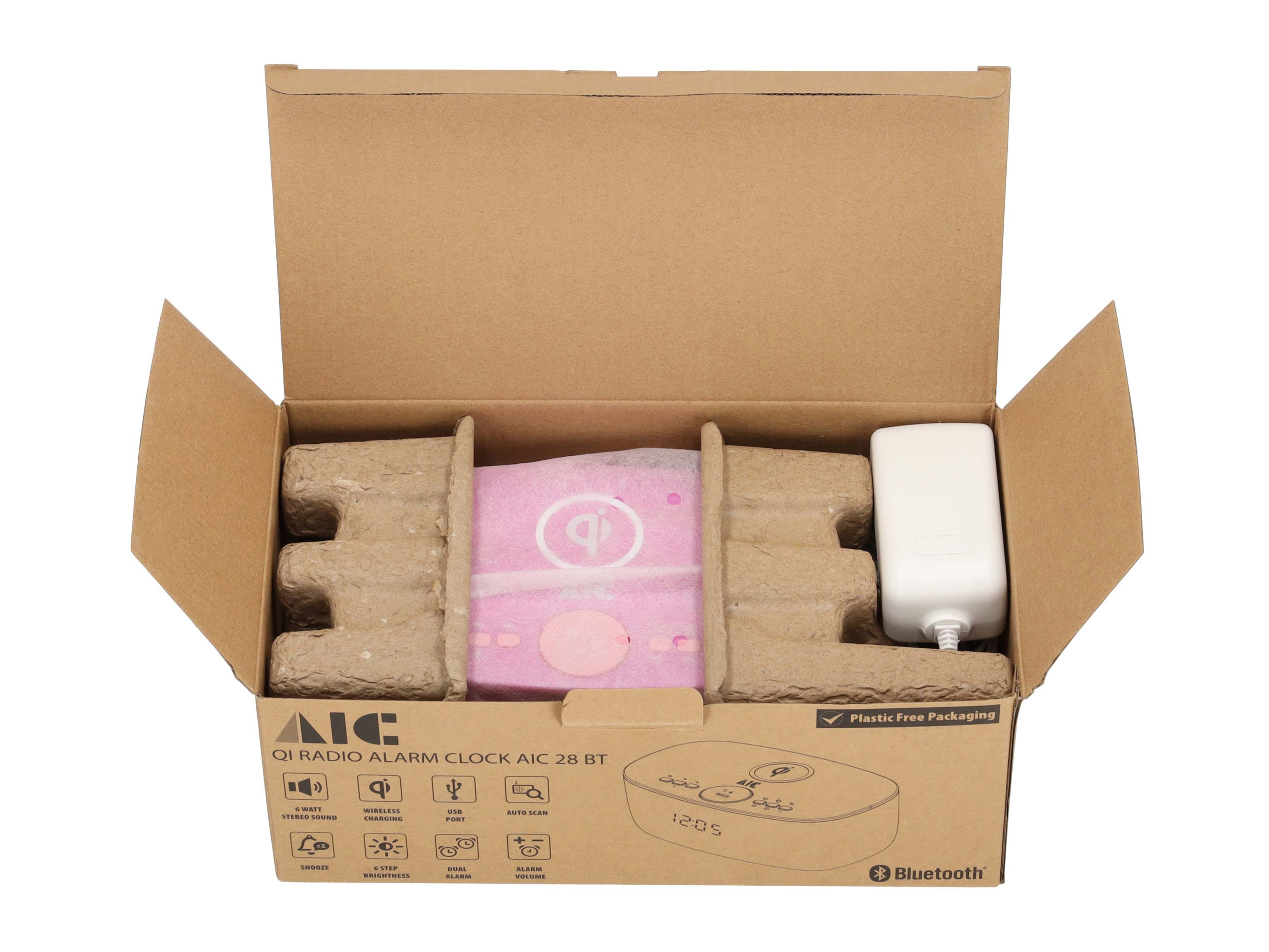 Box mit Wecker und weißem Ladegerät. Die Box ist offen.
