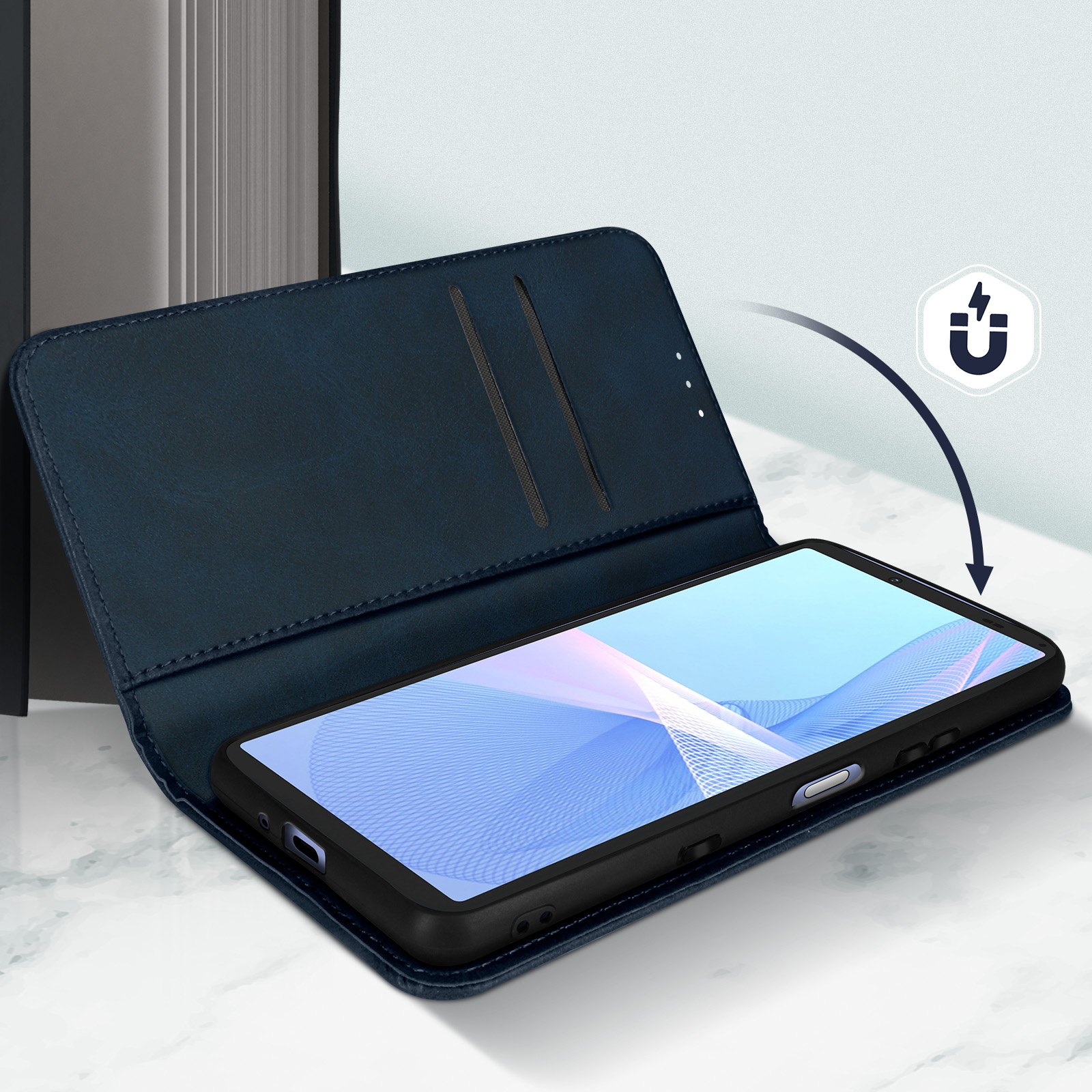 Custodia blu aperta, telefono dentro, simbolo magnetico sul lato.