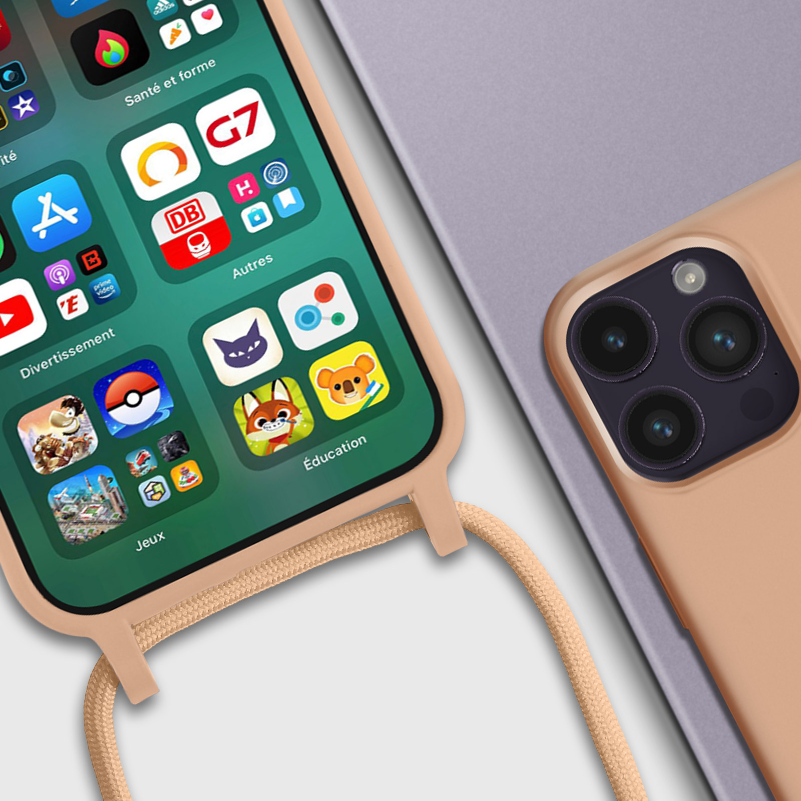 Téléphone avec applications sur écran et étui avec lanière, fond beige.
