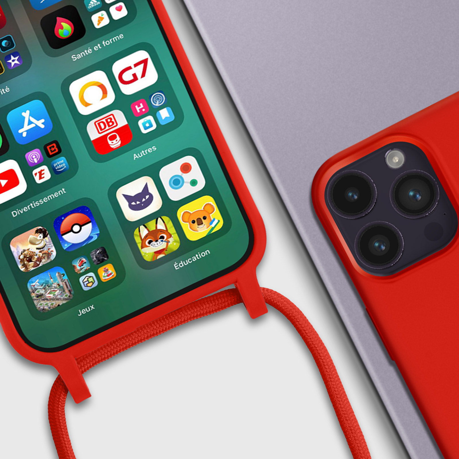 Coque de téléphone rouge avec icônes d'applications, tenue par un cordon rouge. Téléphone gris dessous.