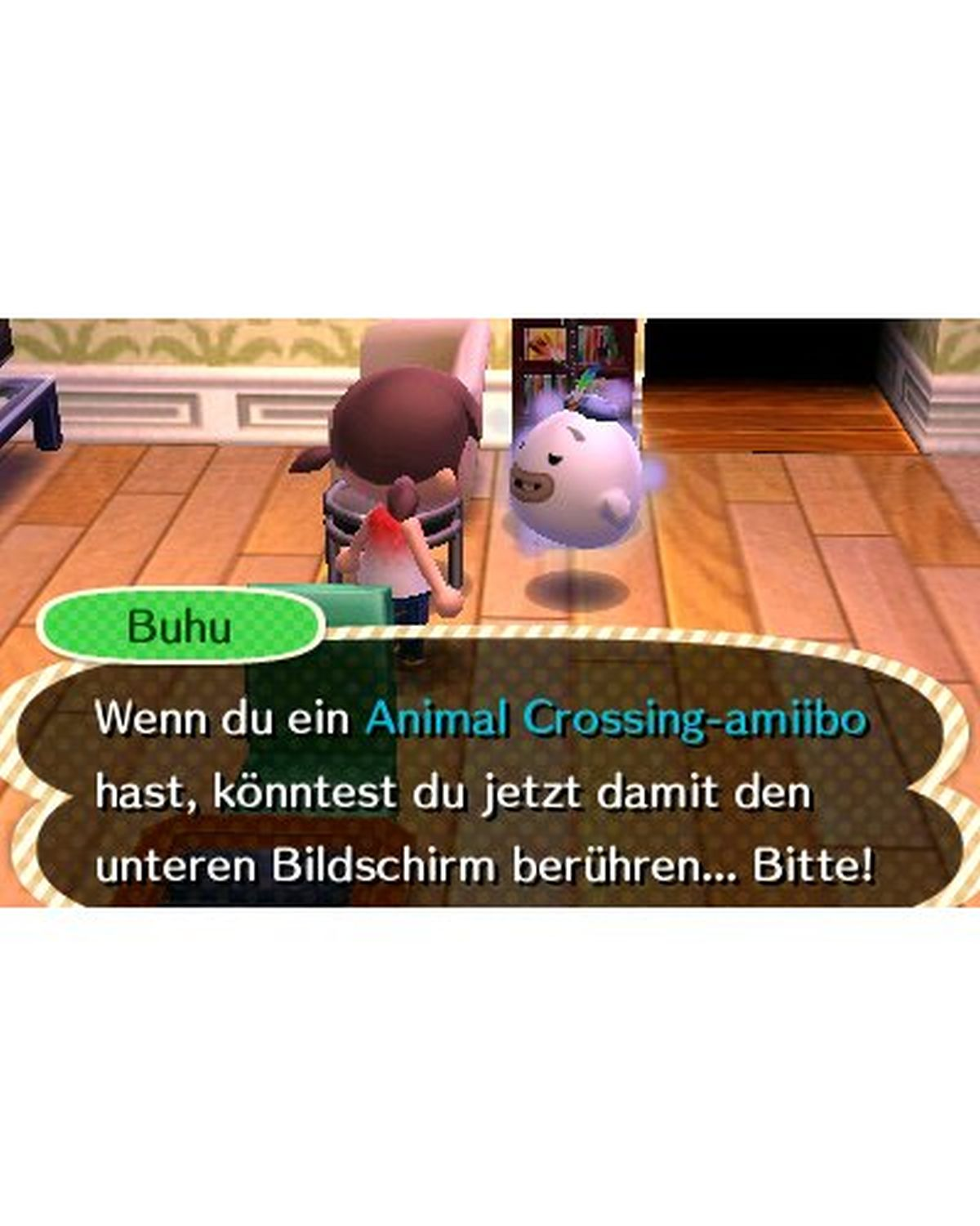 Eine Videospielszenen mit einem Charakter, der spricht. Sprechblase sagt: "Animal Crossing-amiibo...Bitte!"