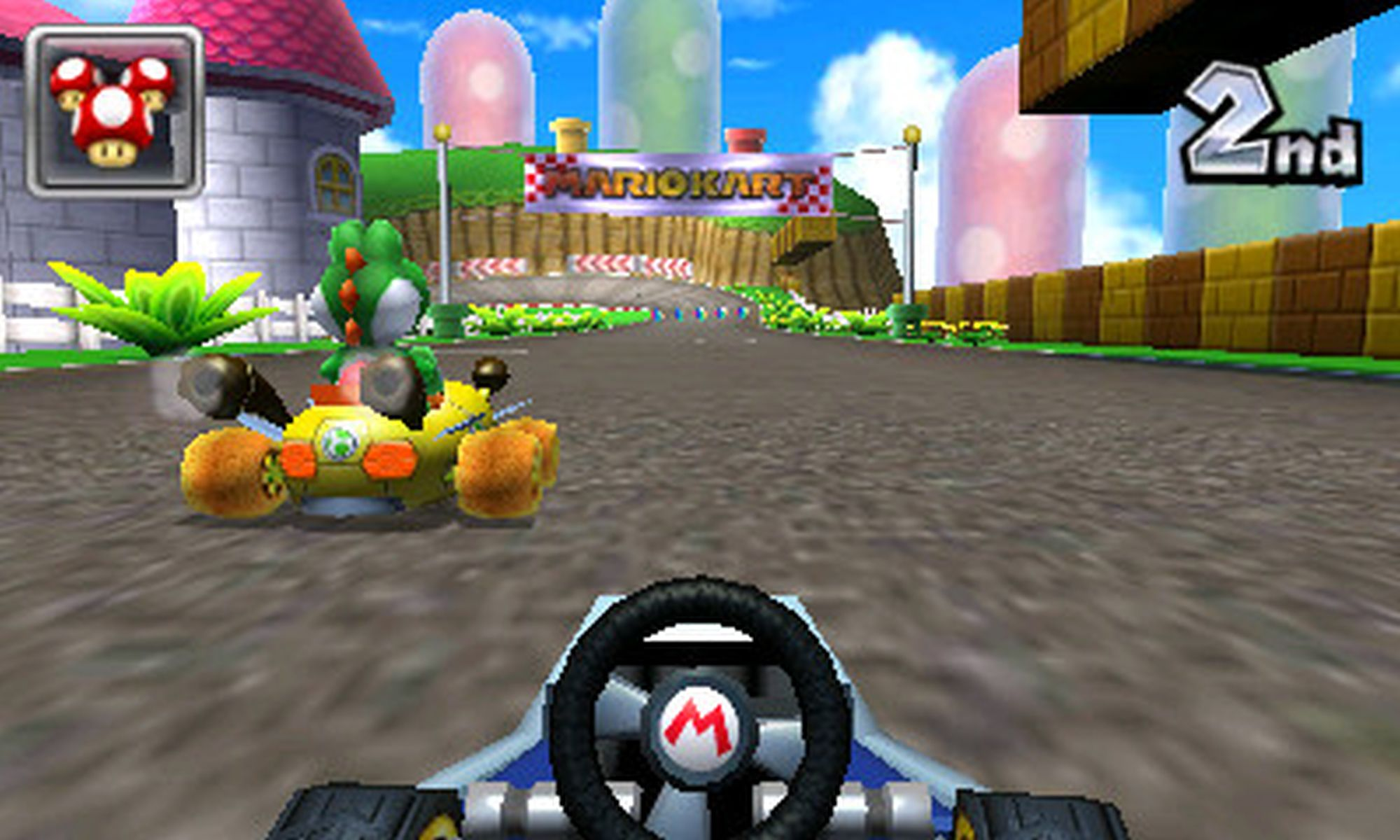 Mario Kart Spielbildschirm, Yoshi fährt, 2. Platz, Kurs mit Mario Kart Banner.
