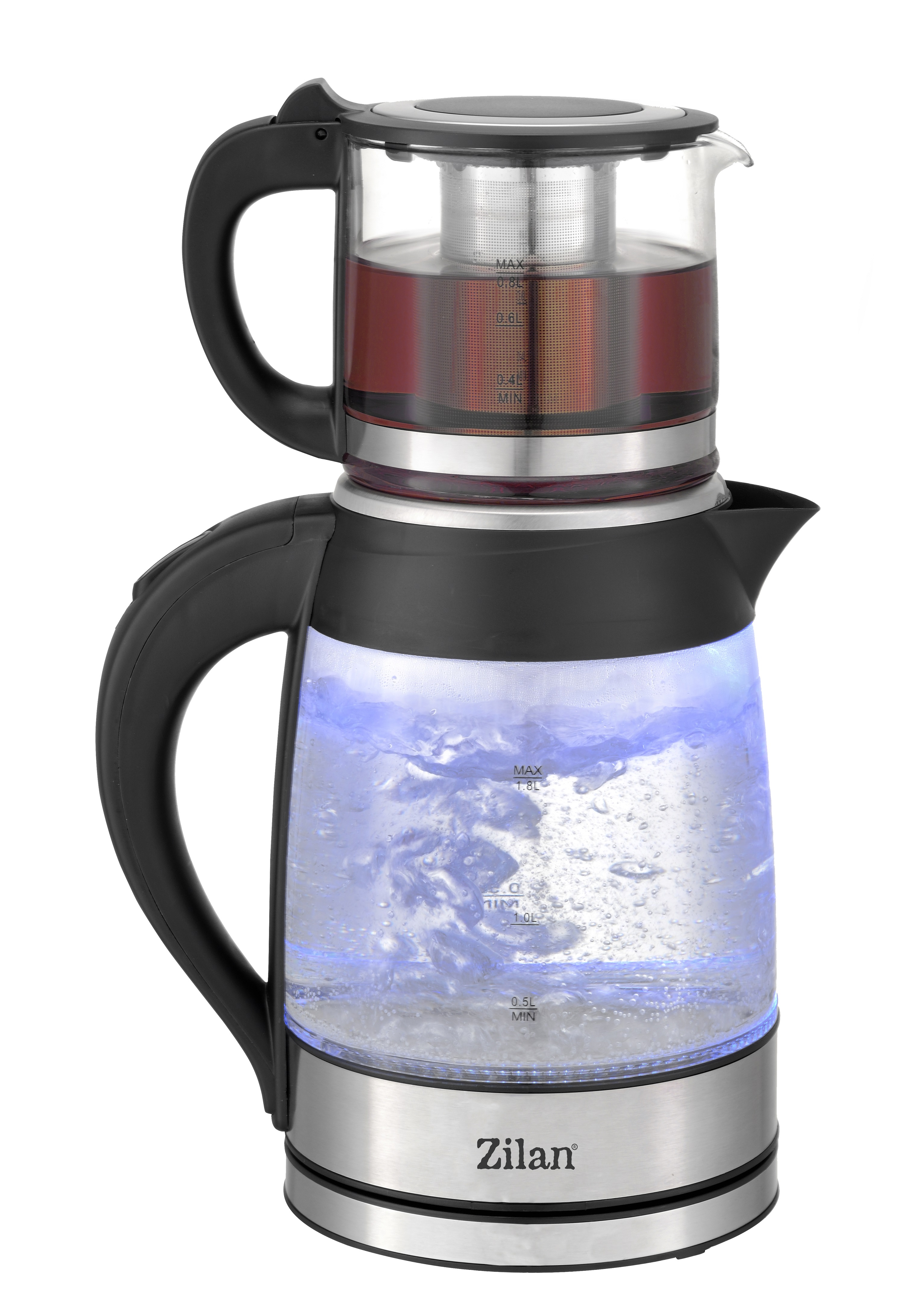 Gläserne Teekanne mit schwarzem Griff, Tee enthaltend und blauem Licht darunter.