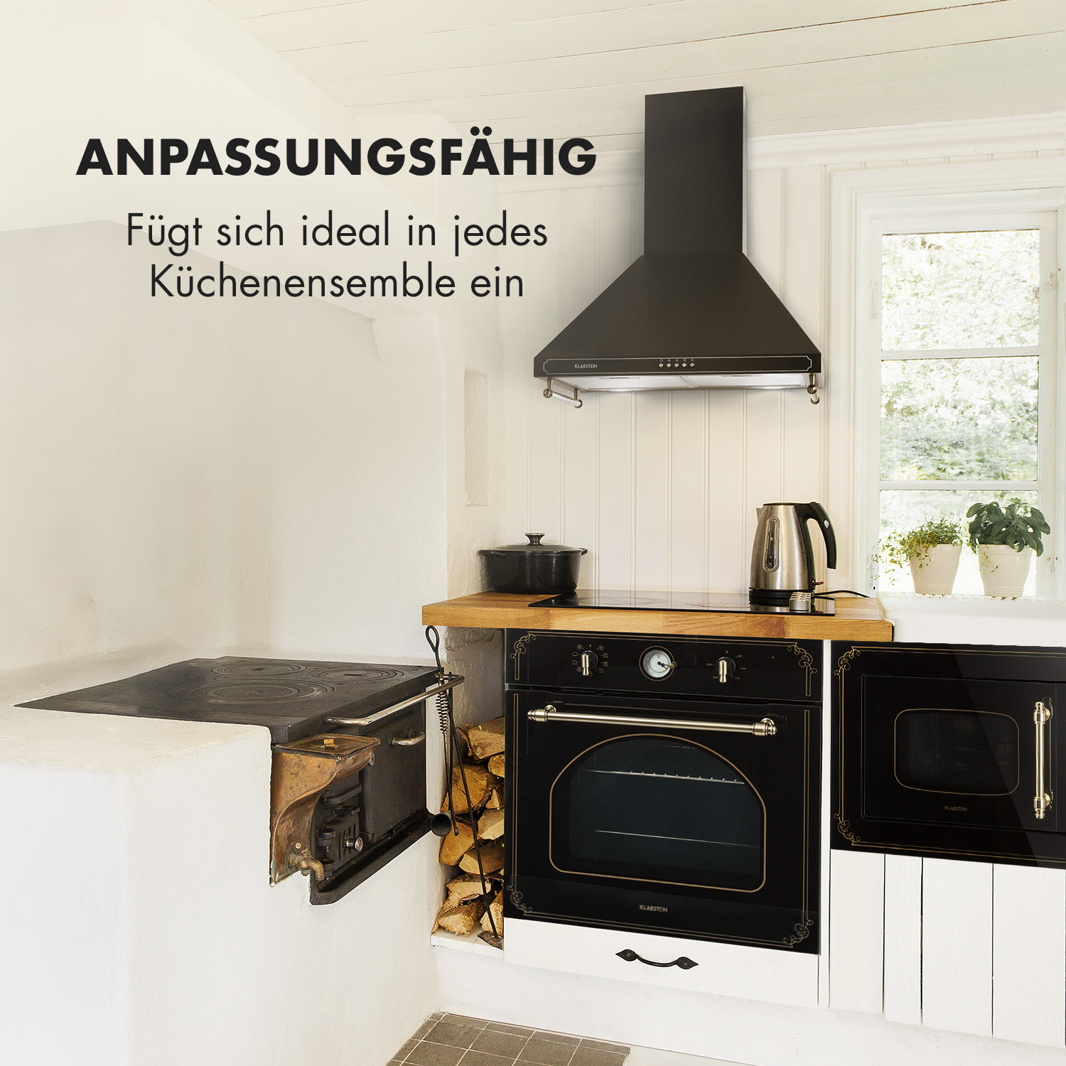Una escena de cocina con horno y campana negros, una estufa y una tetera. El texto dice ANPASSUNGSFÄHIG.