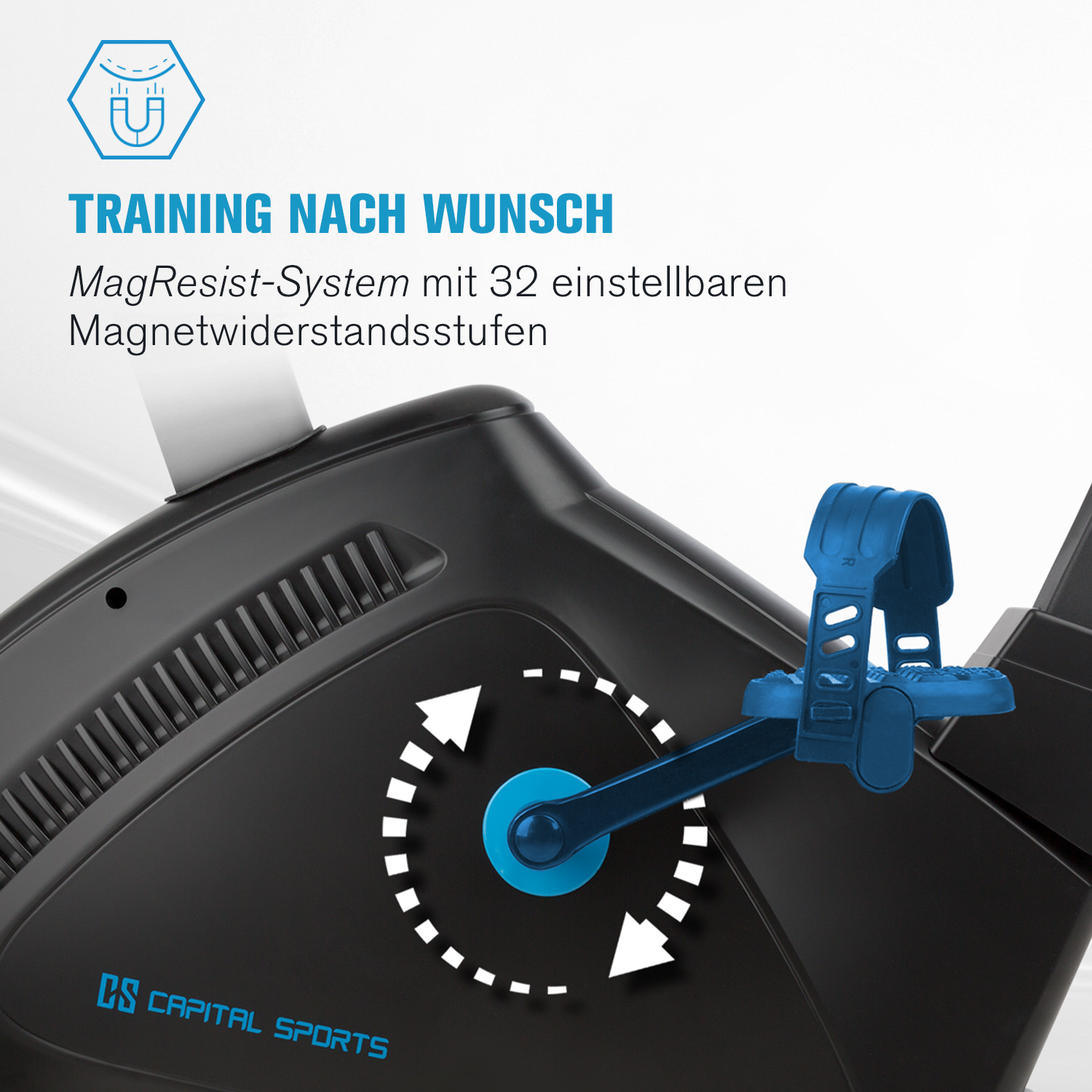 Pedal und Schwungrad eines Heimtrainers mit Pfeilen und Text.