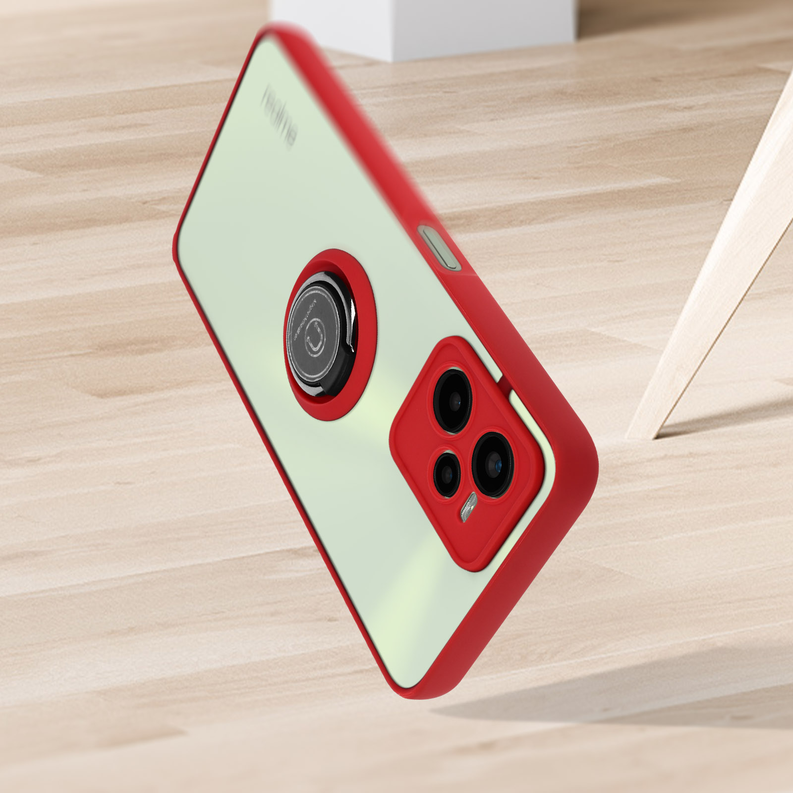 Custodia per telefono rossa e trasparente con un rilievo per la fotocamera. È su una superficie di legno.