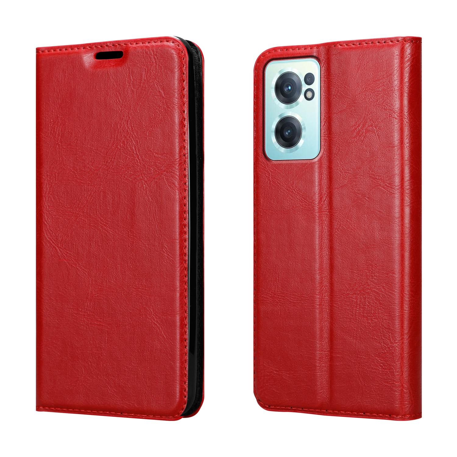 Custodia per telefono in pelle rossa, aperta, che mostra il telefono. La custodia ha una cerniera nera e si trova su sfondo bianco.