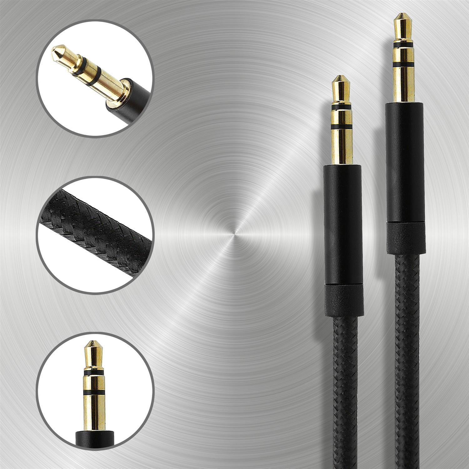 Dos cables de audio jack negros con puntas doradas sobre una superficie metálica.