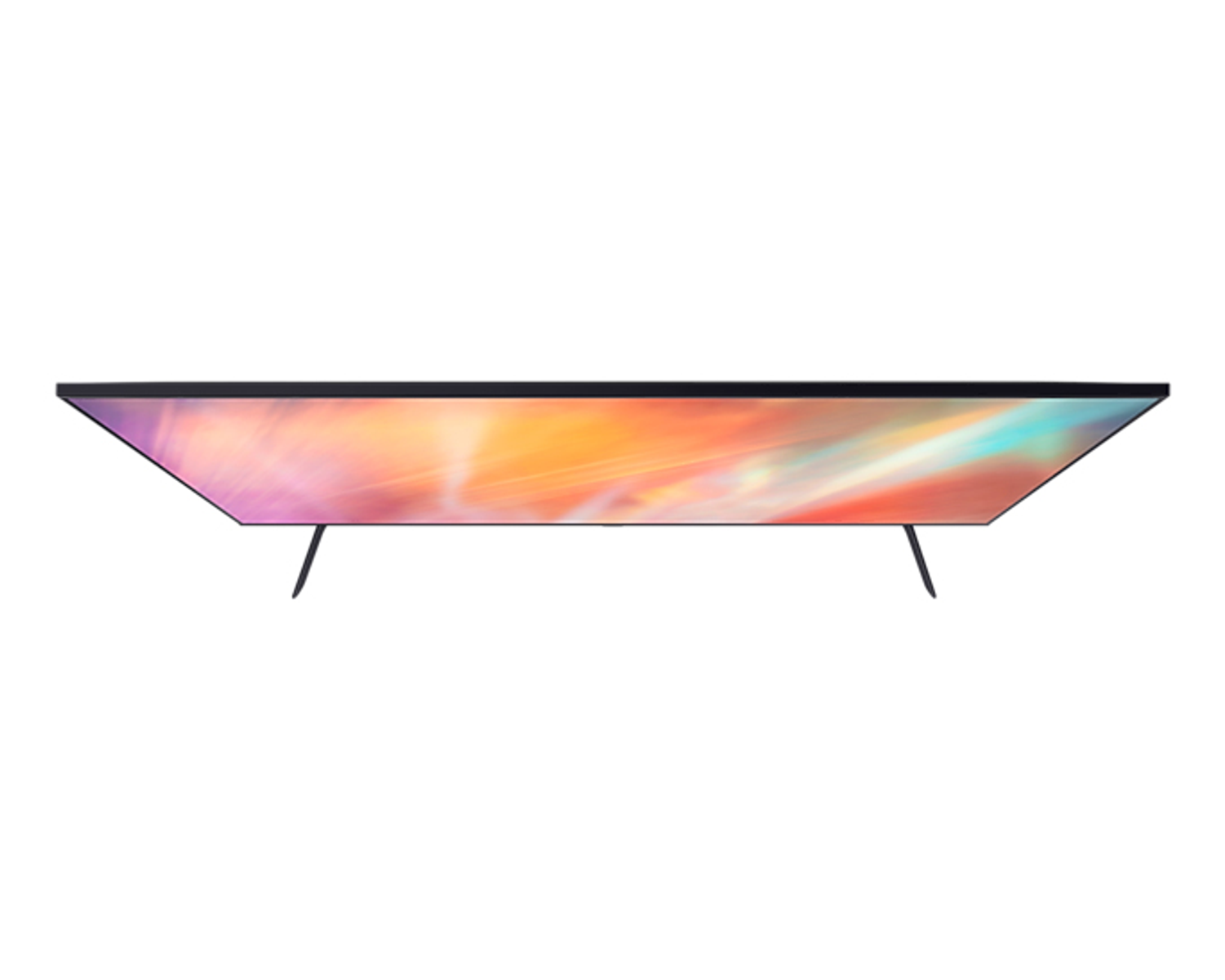 Una vista dall'alto mostra un elegante televisore con uno schermo multicolore e due gambe sottili nere.